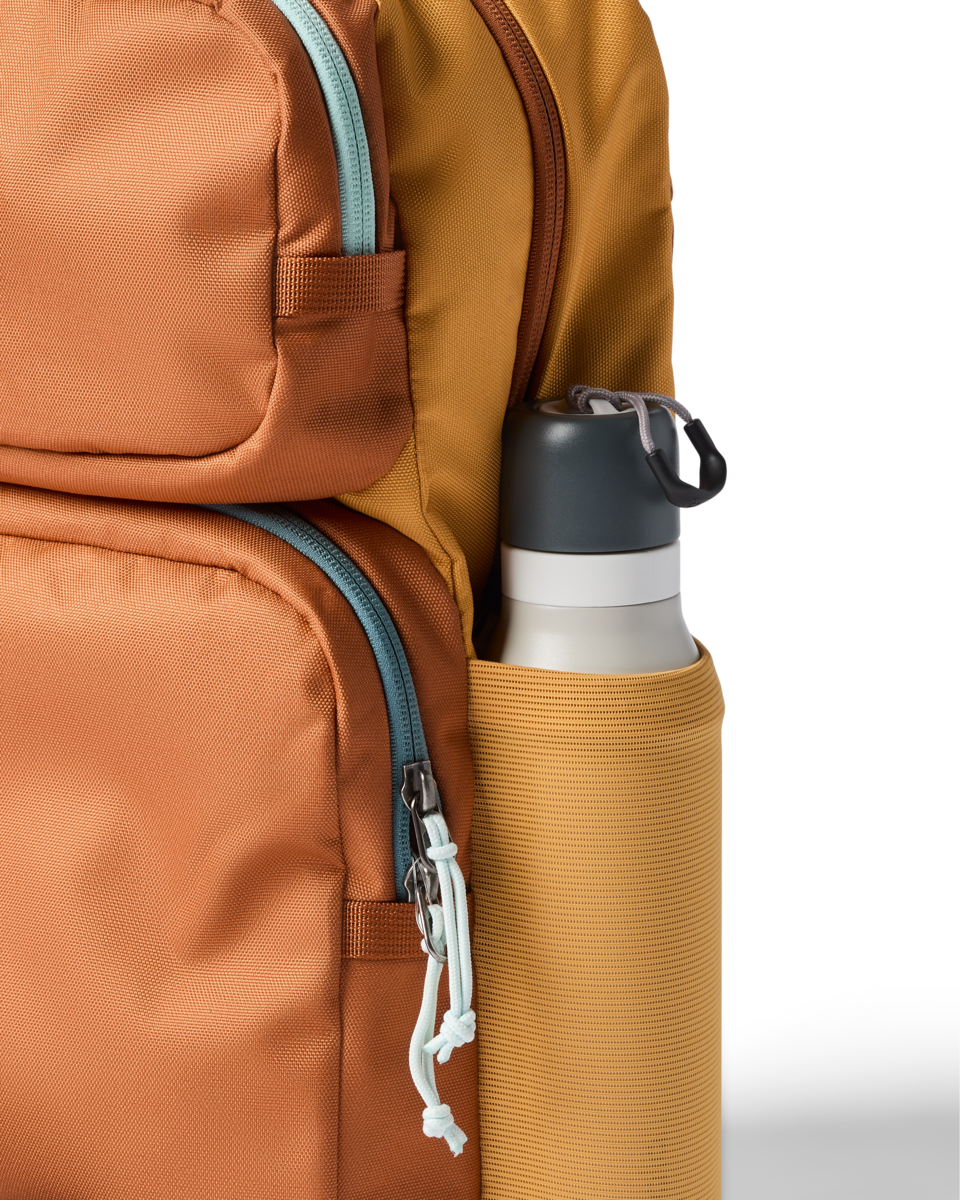 Cotopaxi Tasra 16L Backpack in Whiskey and Honeycomb — angle view 1
