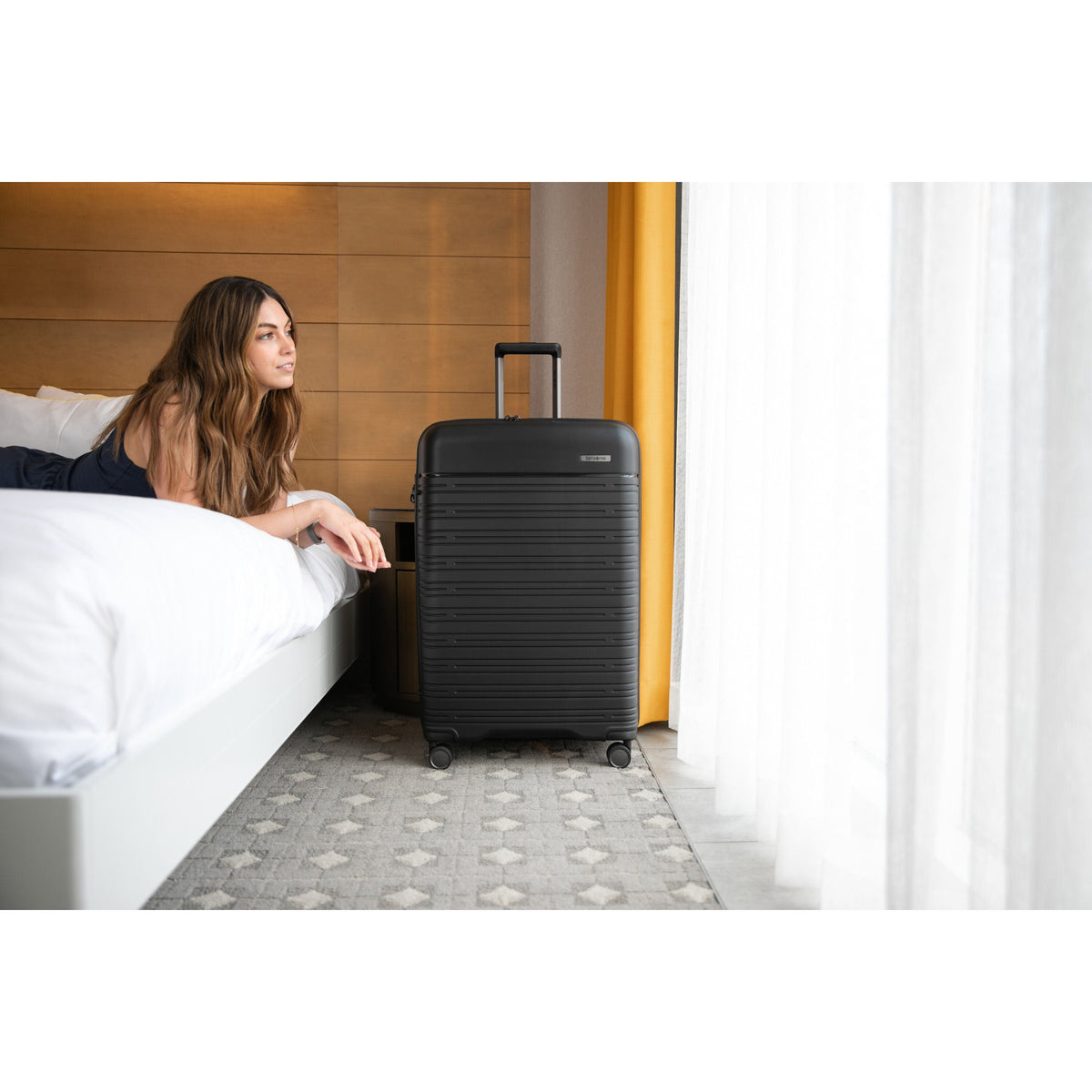 Samsonite Elevation Plus Large Spinner in Triple Black — lifestyle