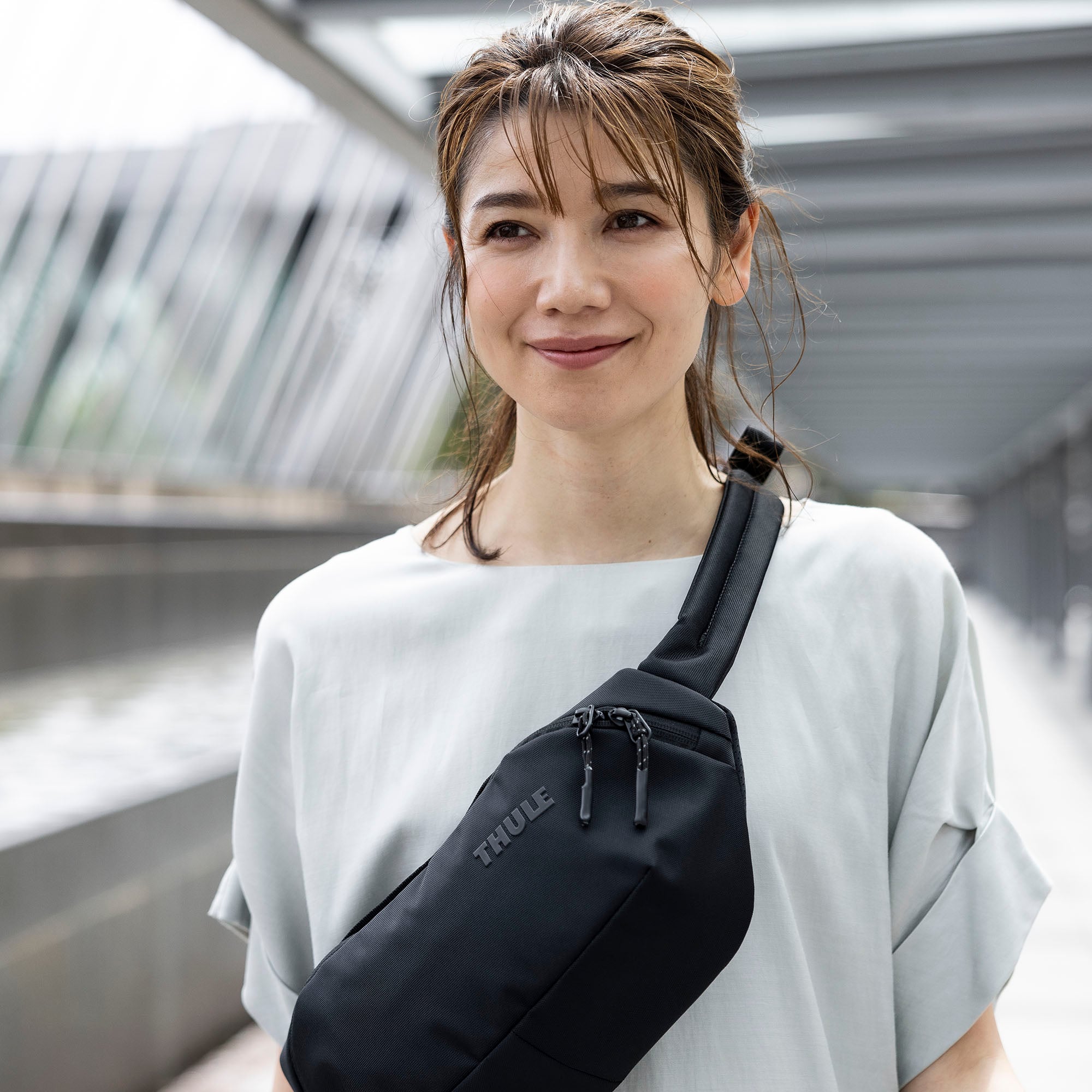 Thule Subterra Sling Bag in Dark Slate — lifestyle 3 # color_Dark Slate