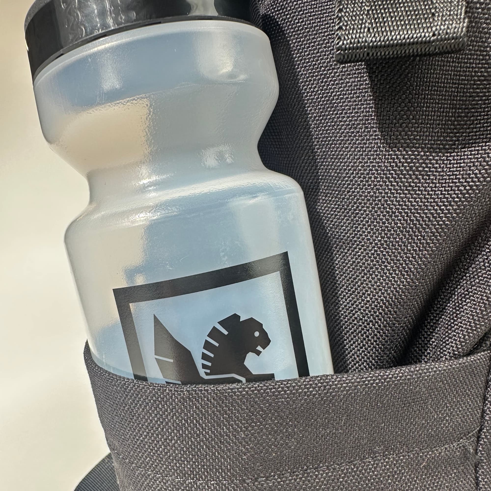 Chrome Industries Purist Water Bottle 22 oz in Clear/Black — angle view 2
