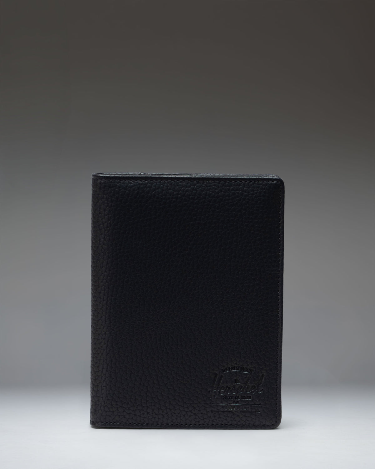 Herschel Raynor Passport Holder Vegan Leather in Black — front view