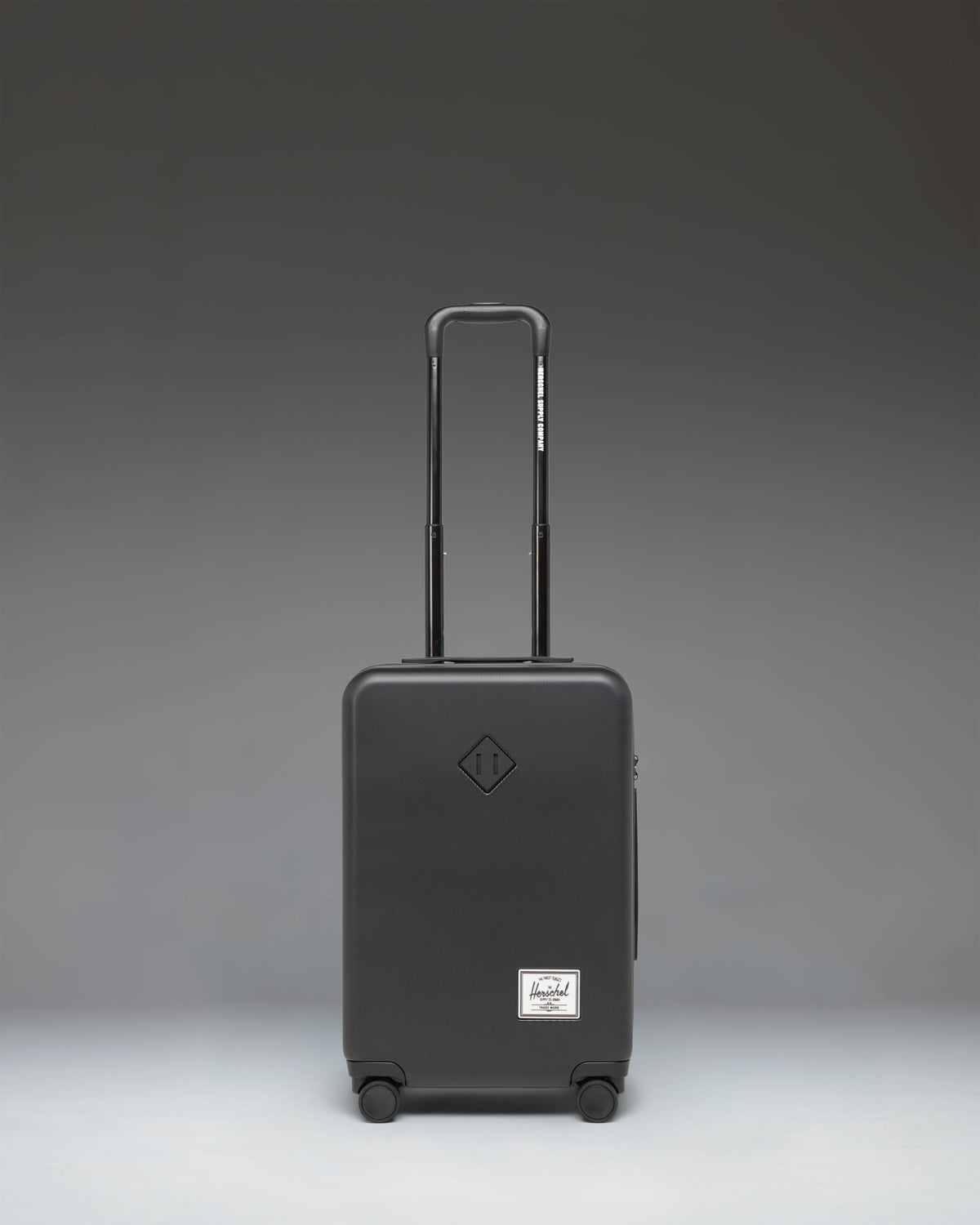 Herschel Heritage Hardshell Large Carry-On Luggage in Black — front view
