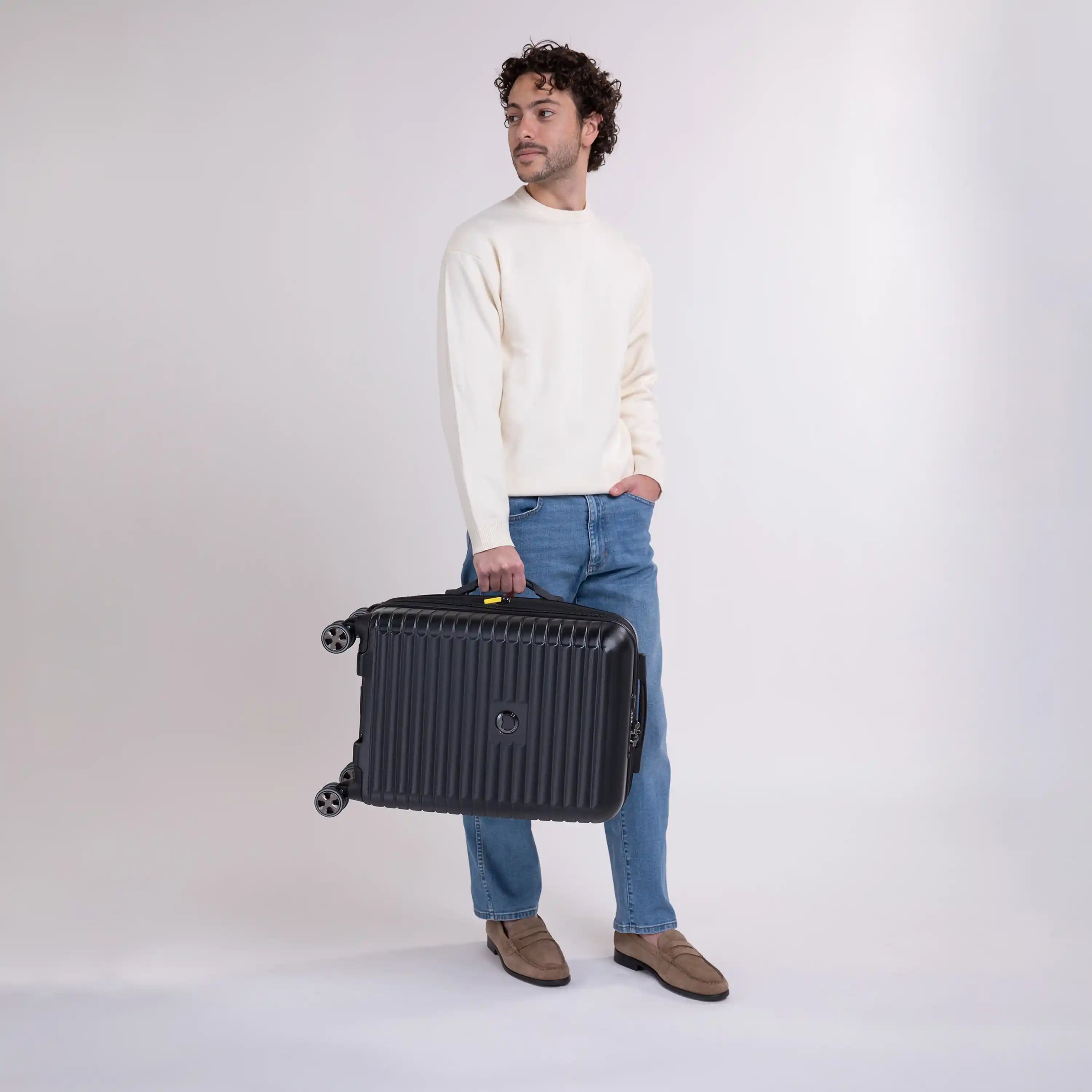 Delsey Cruise 3.0 Carry-On Plus Expandable Spinner in Black — lifestyle # color_Black