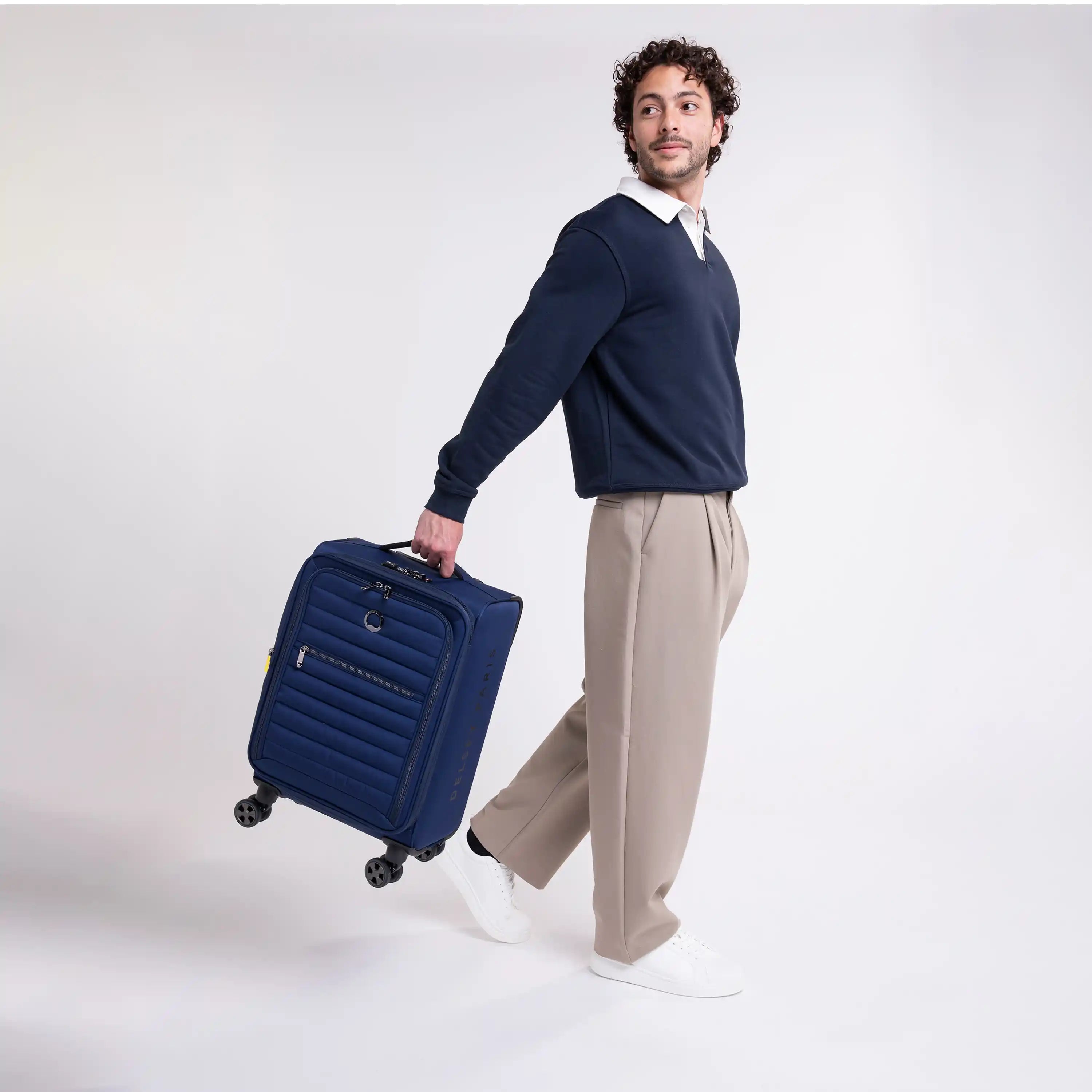 Delsey Cruise 3.0 Softside Carry-On Plus Expandable Spinner in Deep Sea Navy — lifestyle # color_Deep Sea Navy