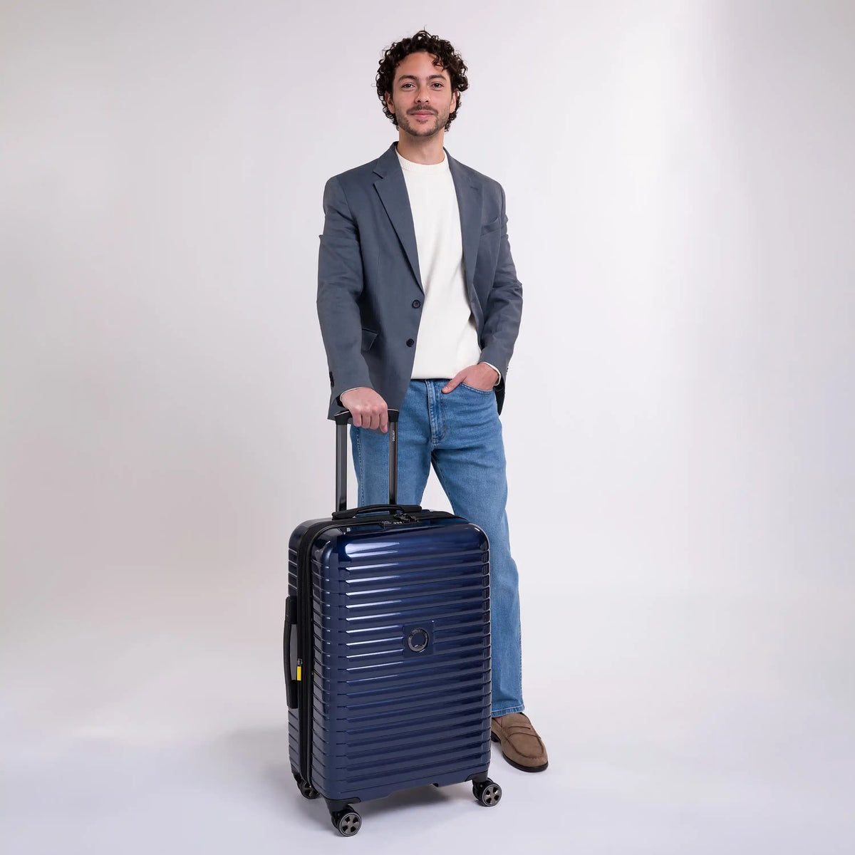Delsey Cruise 3.0 Medium Expandable Spinner in Deep Sea Navy — lifestyle # color_Deep Sea Navy