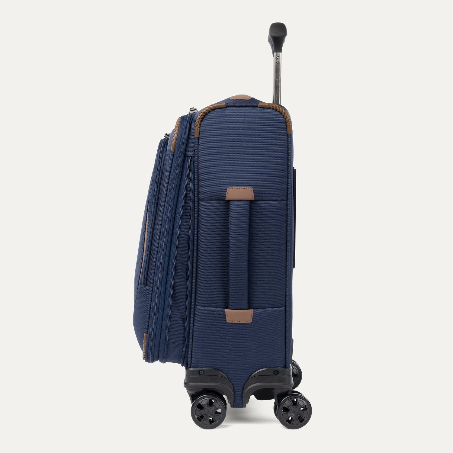 Travelpro Crew Classic Compact Carry-On Expandable Spinner in Patriot Blue — lifestyle