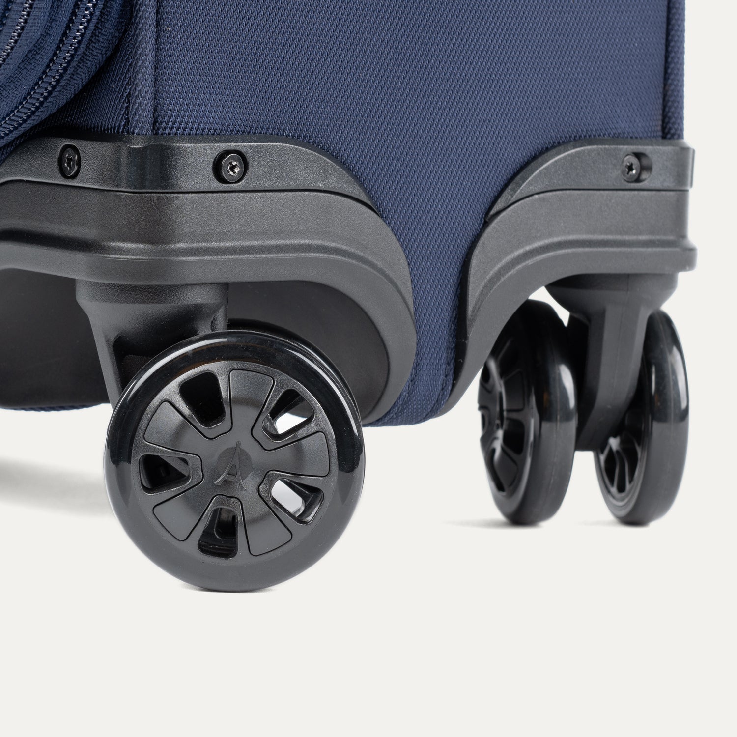 Travelpro Crew Classic Compact Carry-On Expandable Spinner in Patriot Blue — lifestyle 2