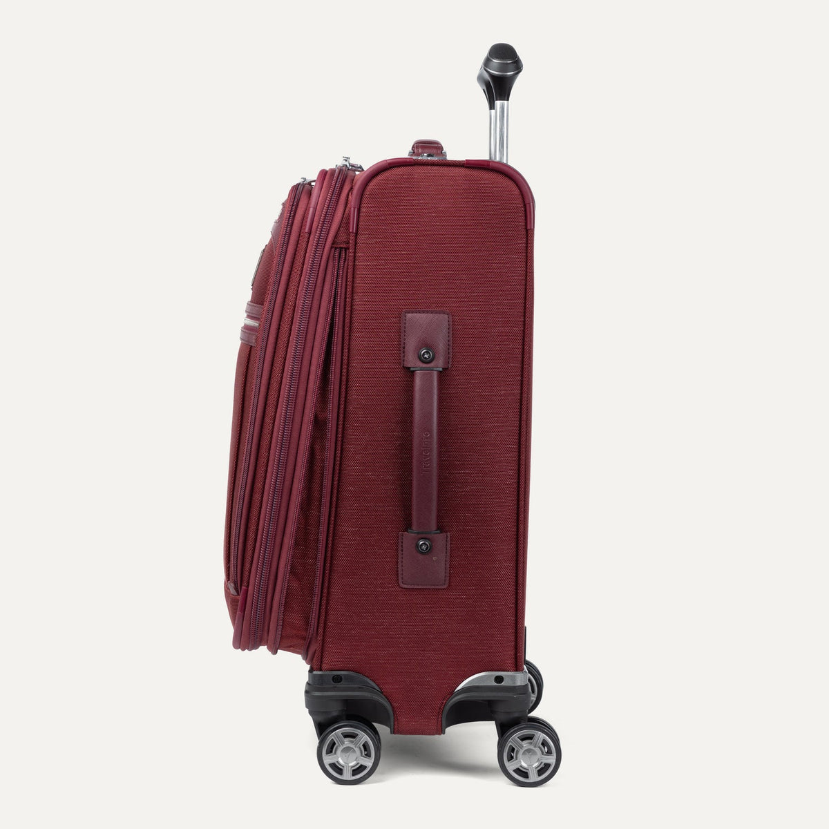 Travelpro Platinum Elite 21” Expandable Carry-On Spinner in Bordeaux — angle view 3