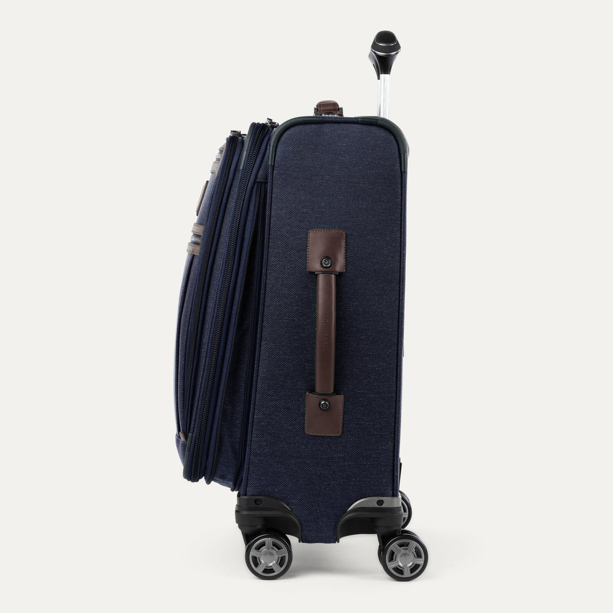 Travelpro Platinum Elite 21” Expandable Carry-On Spinner in True Navy — angle view 3