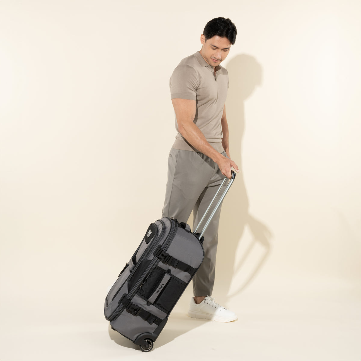 Travelpro Bold By Travelpro 25" Check-In Expandable Rollaboard in Gray Black — lifestyle