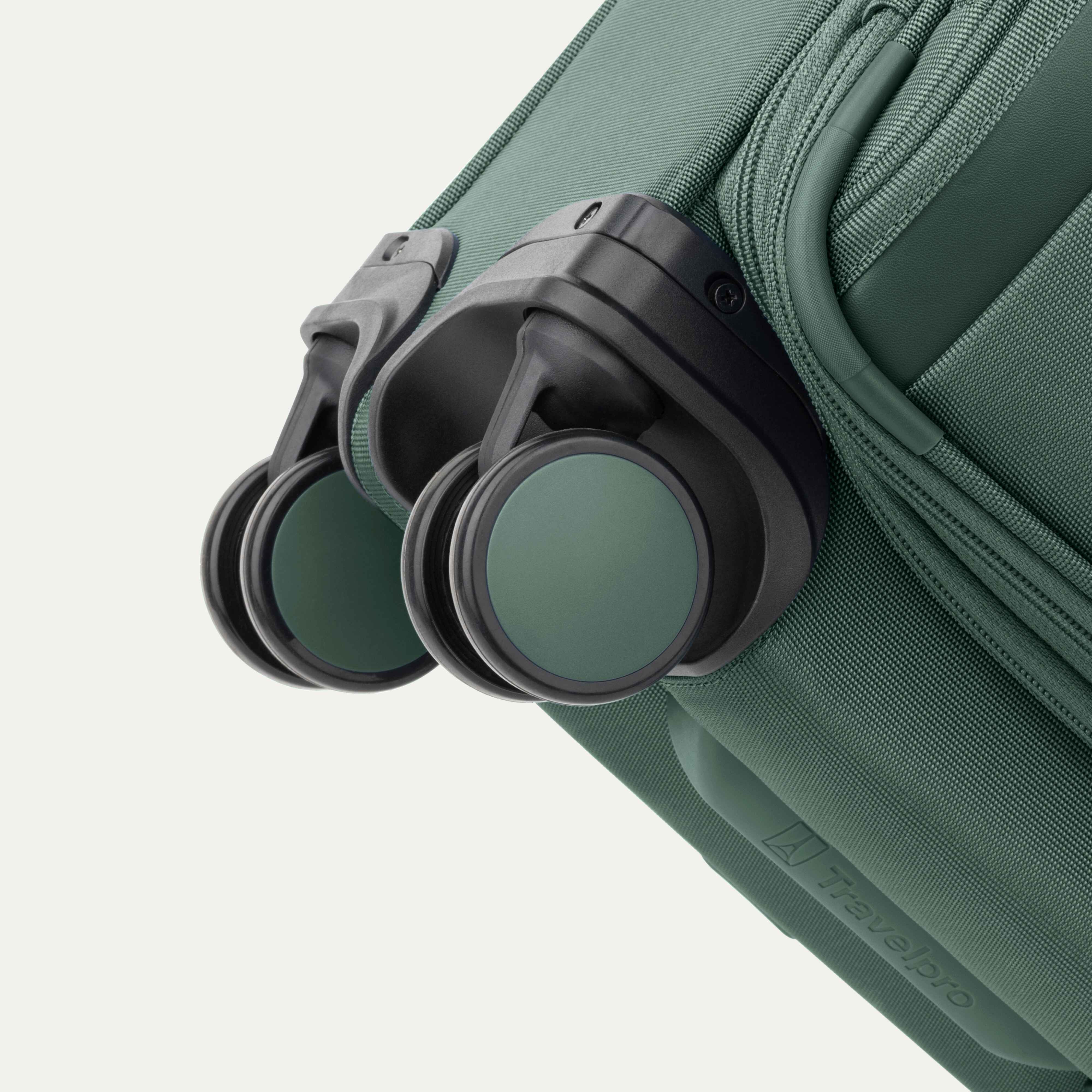 Travelpro VersaPack+ Compact Carry-On Spinner in Desert Sage Green — lifestyle