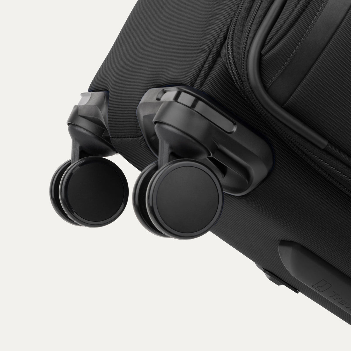 Travelpro VersaPack+ Medium Check-In Spinner in Black — detail view