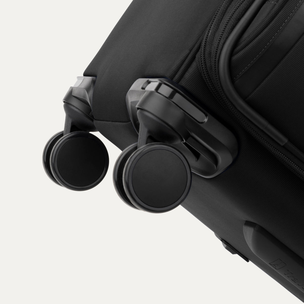 Travelpro VersaPack+ Large Check-In Spinner in Black — detail view