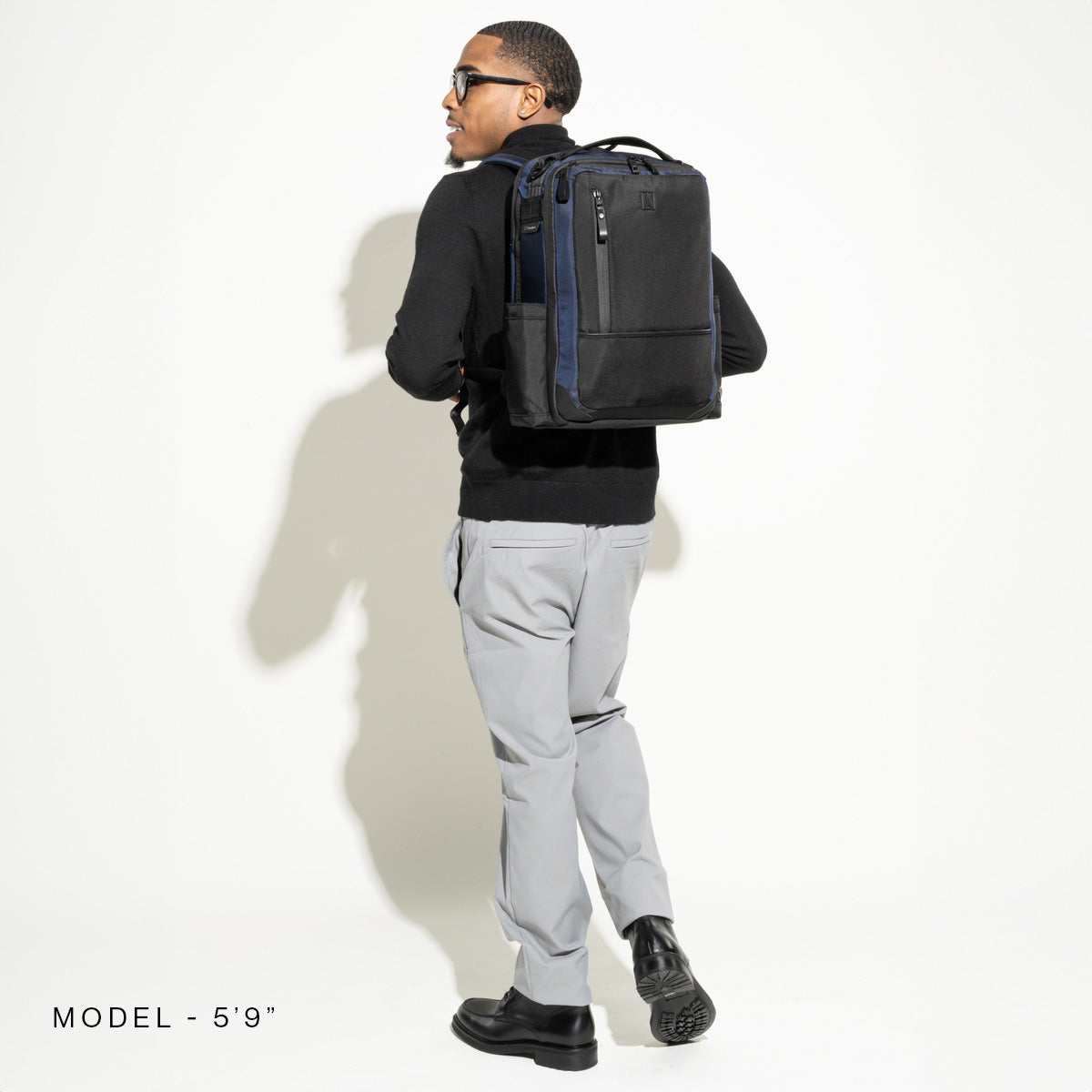 Travelpro Altitude Slim Expandable Laptop Backpack 20-24L in Aviator Navy — lifestyle view