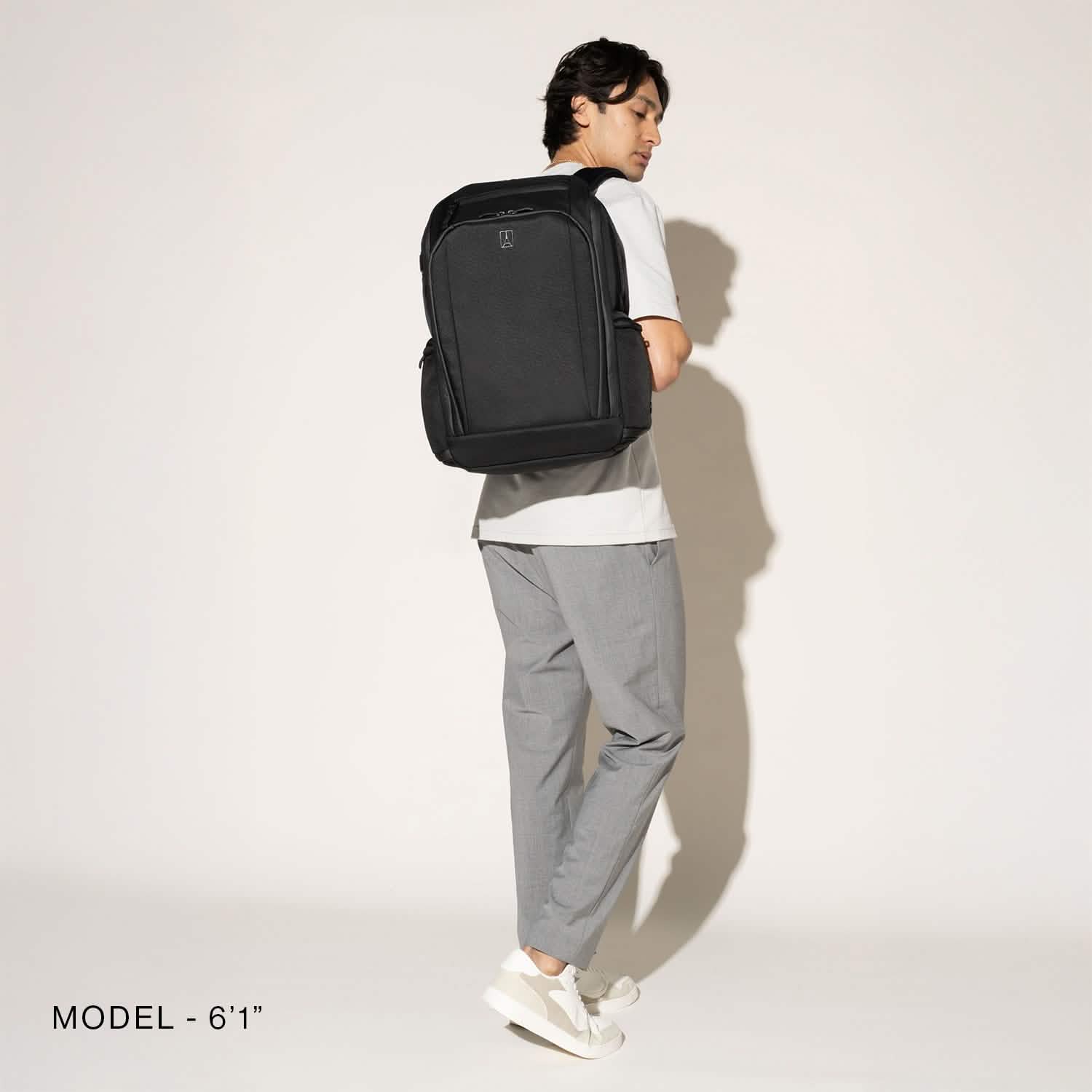 Travelpro Altitude All-Purpose Full Expansion Laptop Backpack 24-34L in Jet Black — lifestyle view