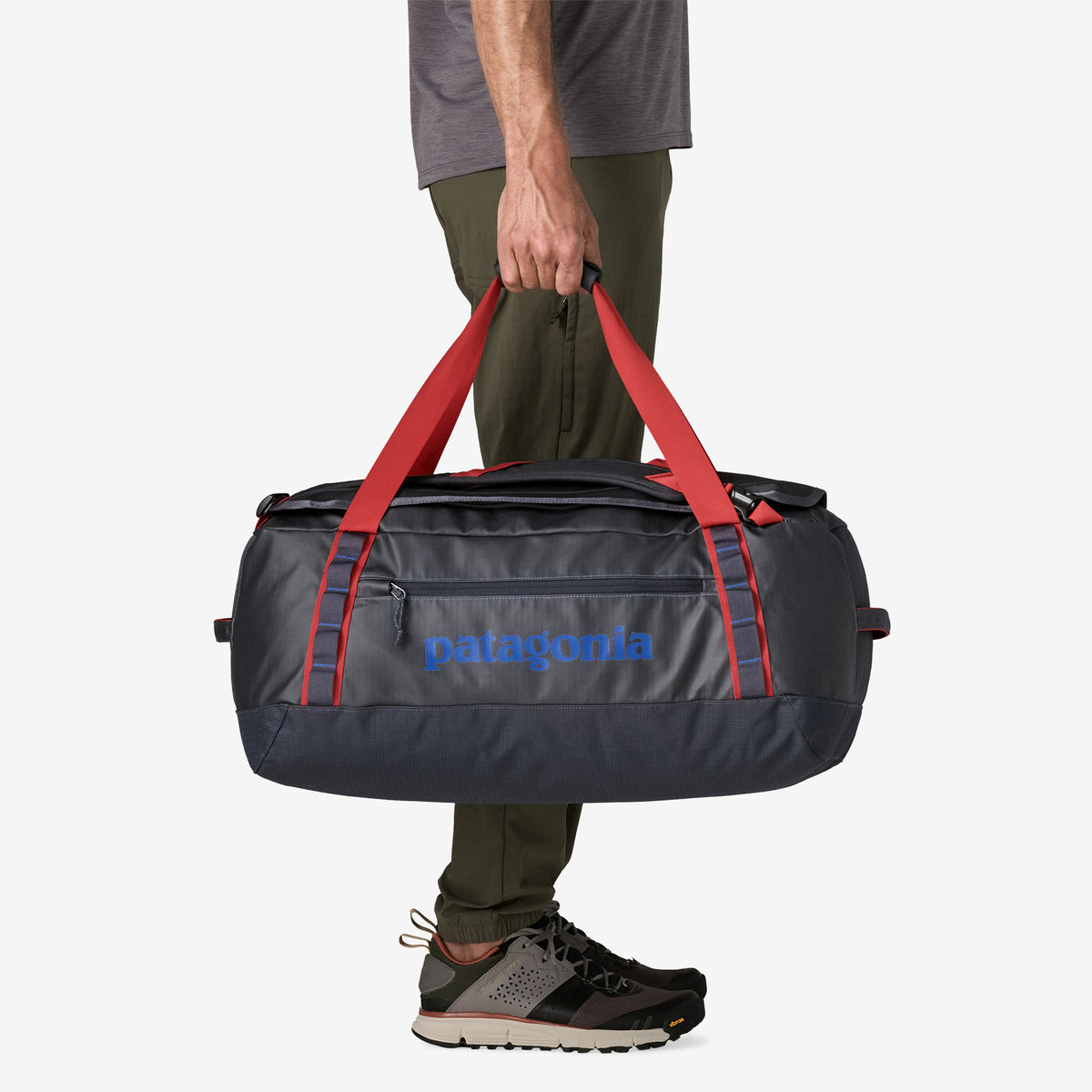 Patagonia Black Hole Duffel 55L in Smolder Blue/Amanita Red — lifestyle 3