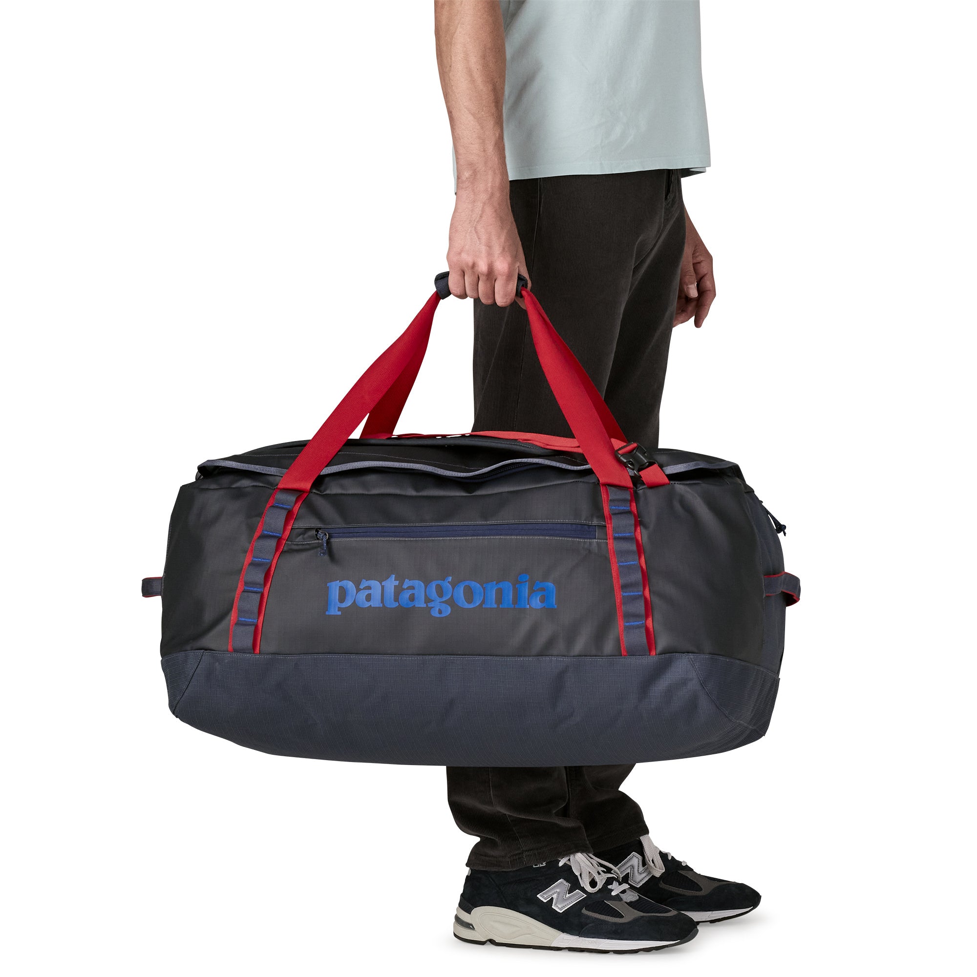 Patagonia Black Hole Duffel 70L in Smolder Blue/Amanita Red — angle view 1