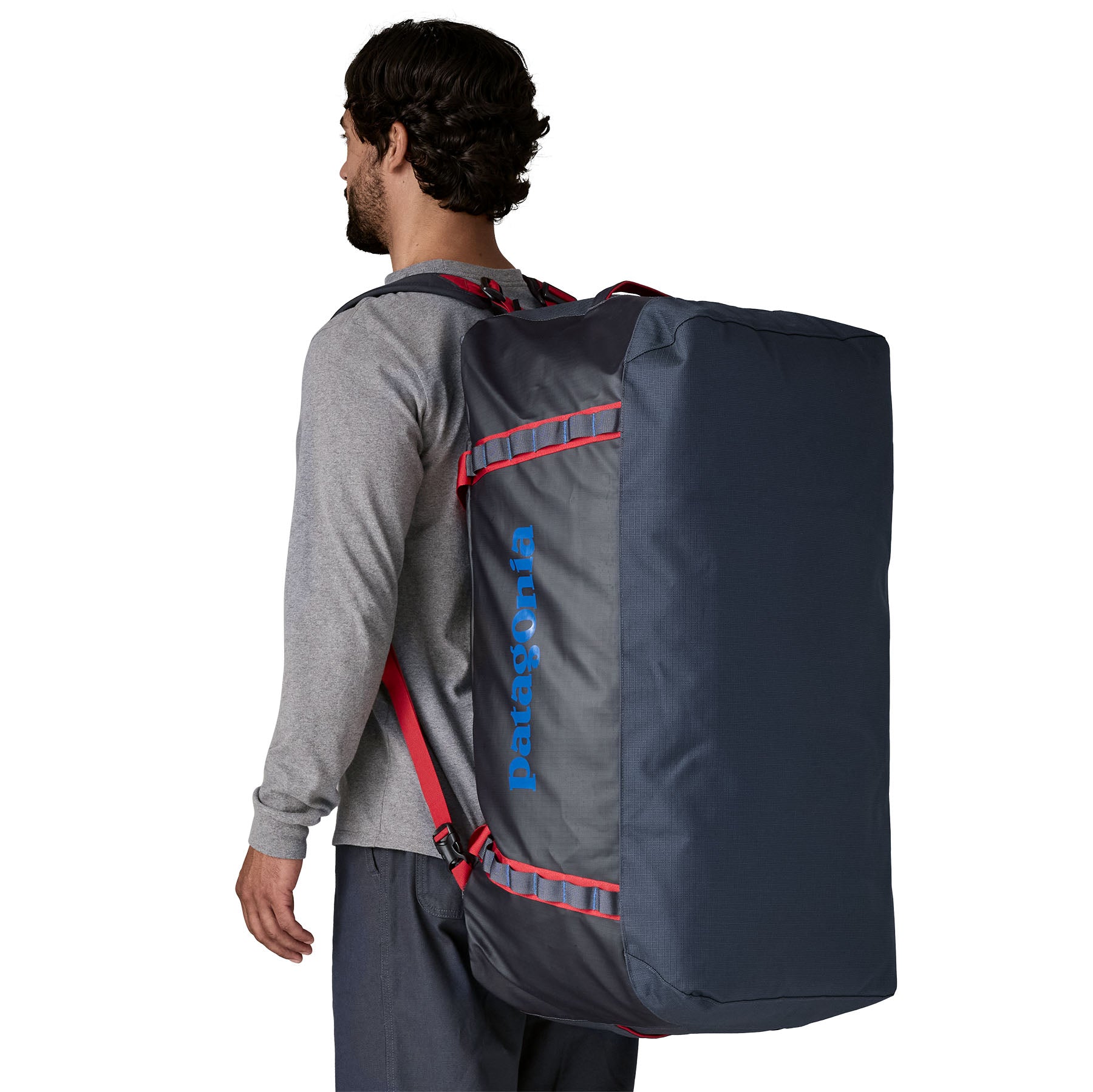Patagonia Black Hole Duffel 100L in Smolder Blue/Amanita Red — lifestyle
