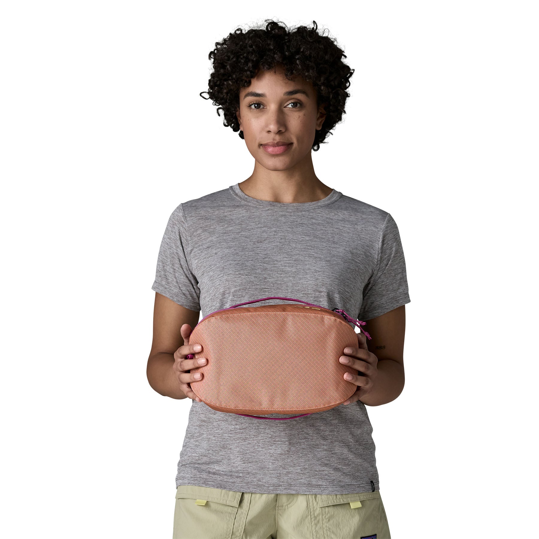 Patagonia Black Hole Cube 6L in Peach Sherbet — lifestyle