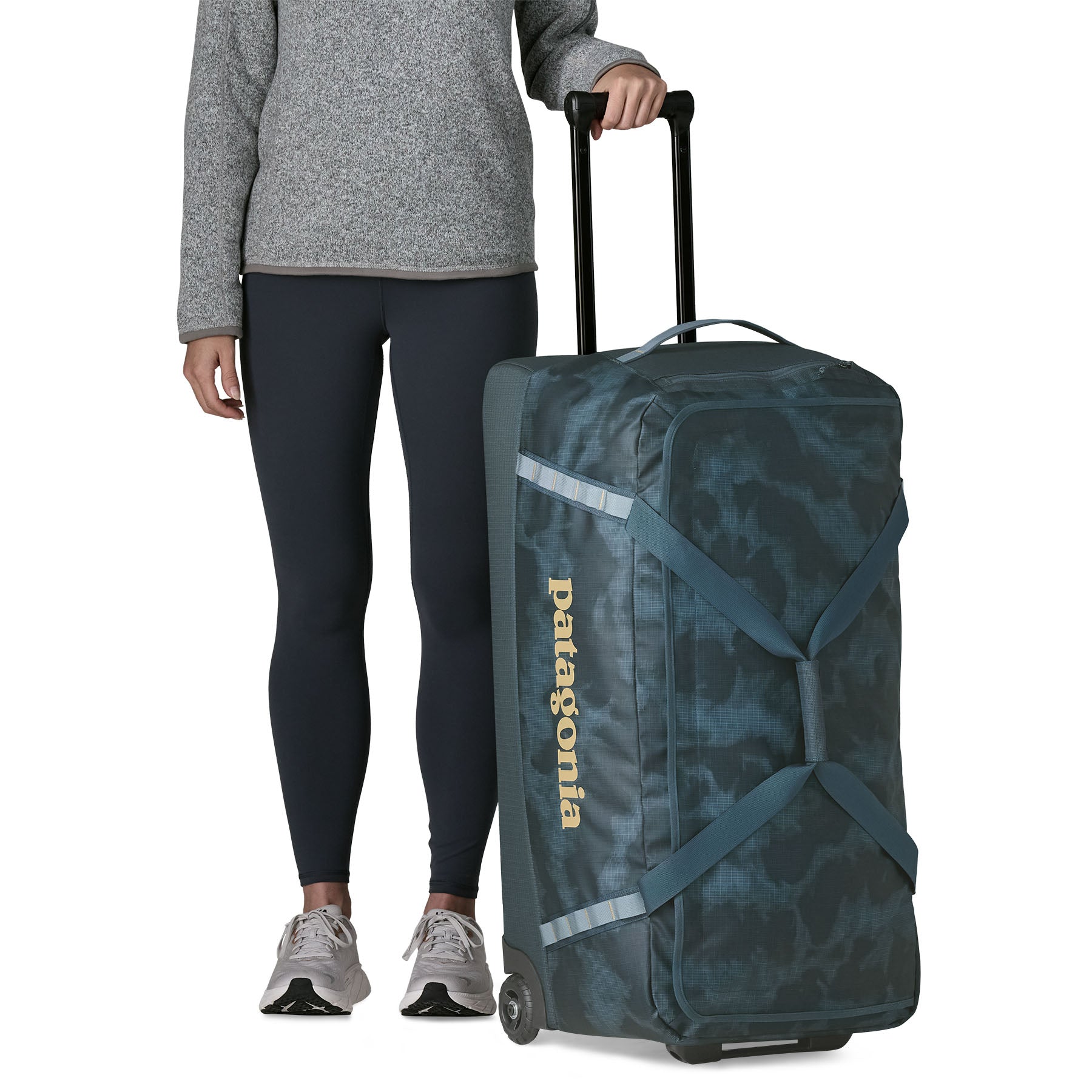Patagonia Black Hole Wheeled Duffel 100L in Sastrugi: Summit Blue — lifestyle 2