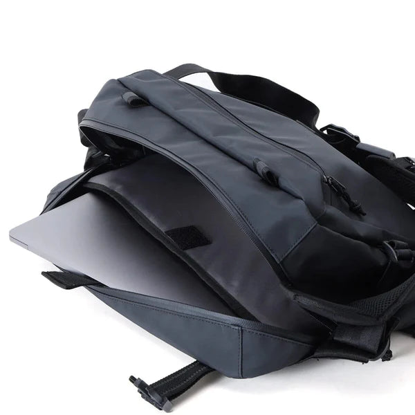 Chrome Industries Kadet Max 15L sling bag – worn by a model, worn across the body
