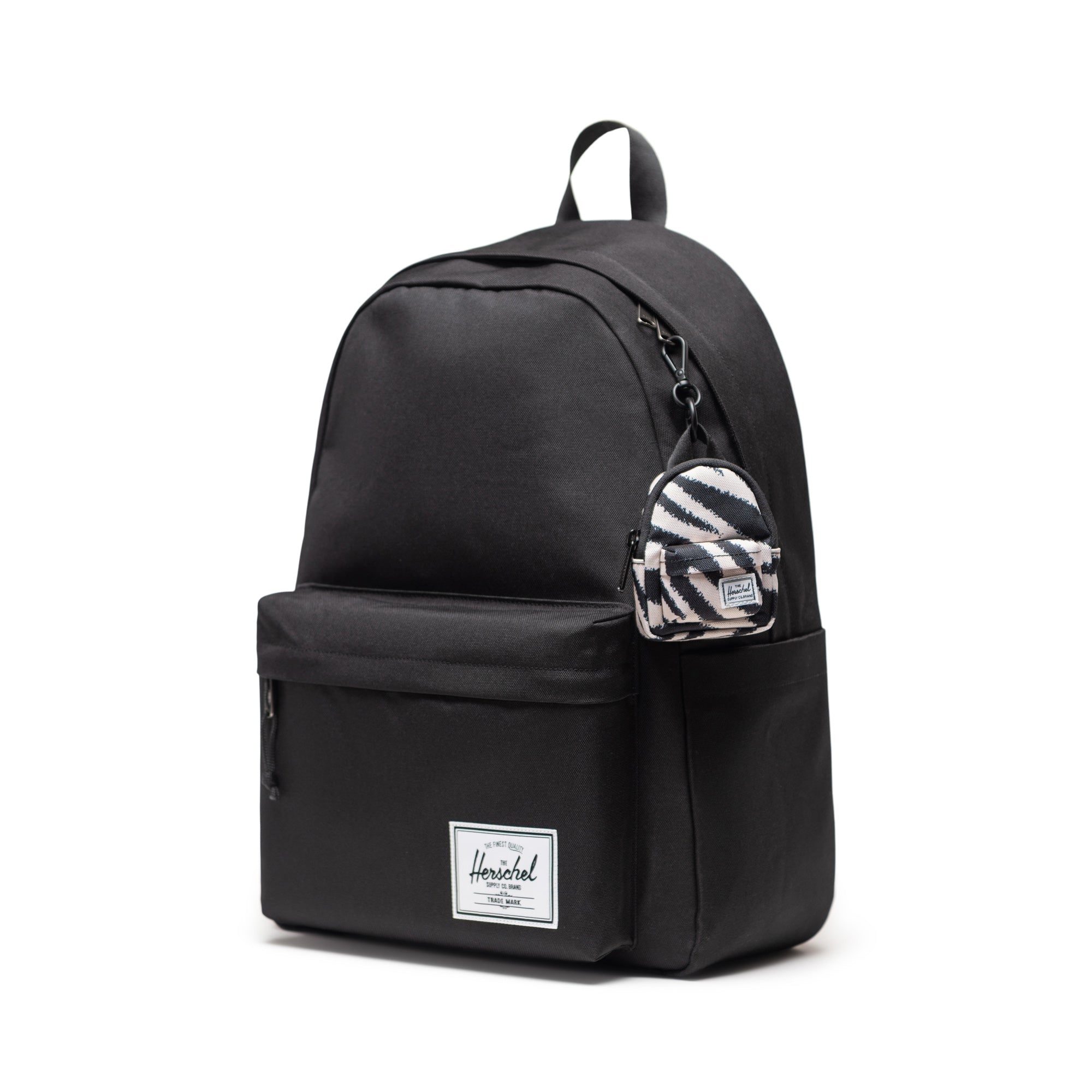 Herschel Classic Backpack Bag Charm in Zebra — shown attached to a Herschel Classic backpack