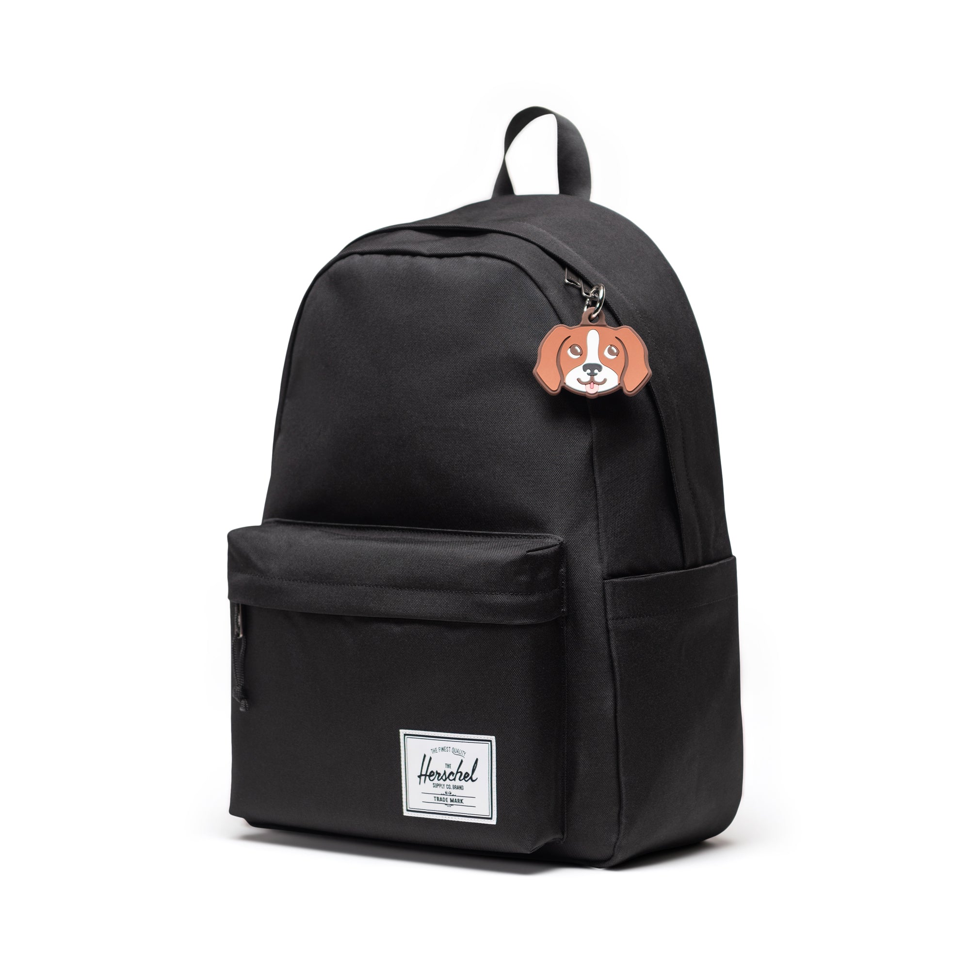 Herschel Dog Bag Charm in Brown Dog — shown attached to a Herschel Classic backpack