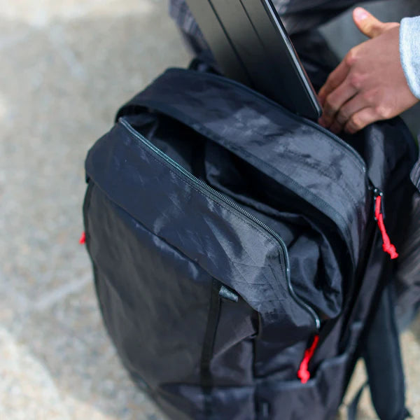 Chrome Industries Cohesive 2.0 38L travel pack – black, main compartment open showing packing