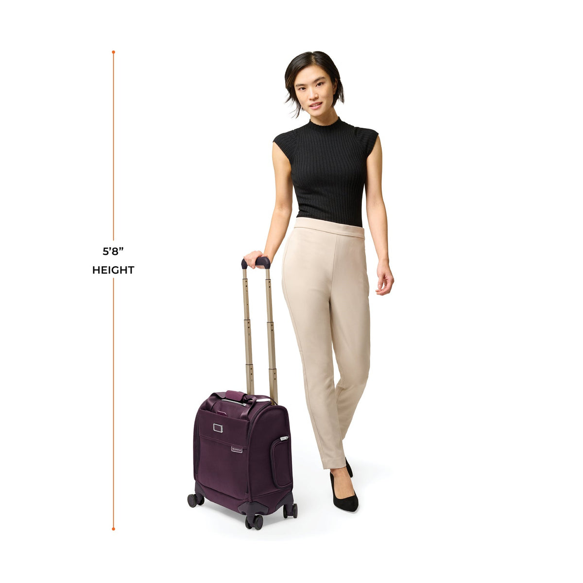 Briggs & Riley Baseline Cabin Spinner in Plum — lifestyle