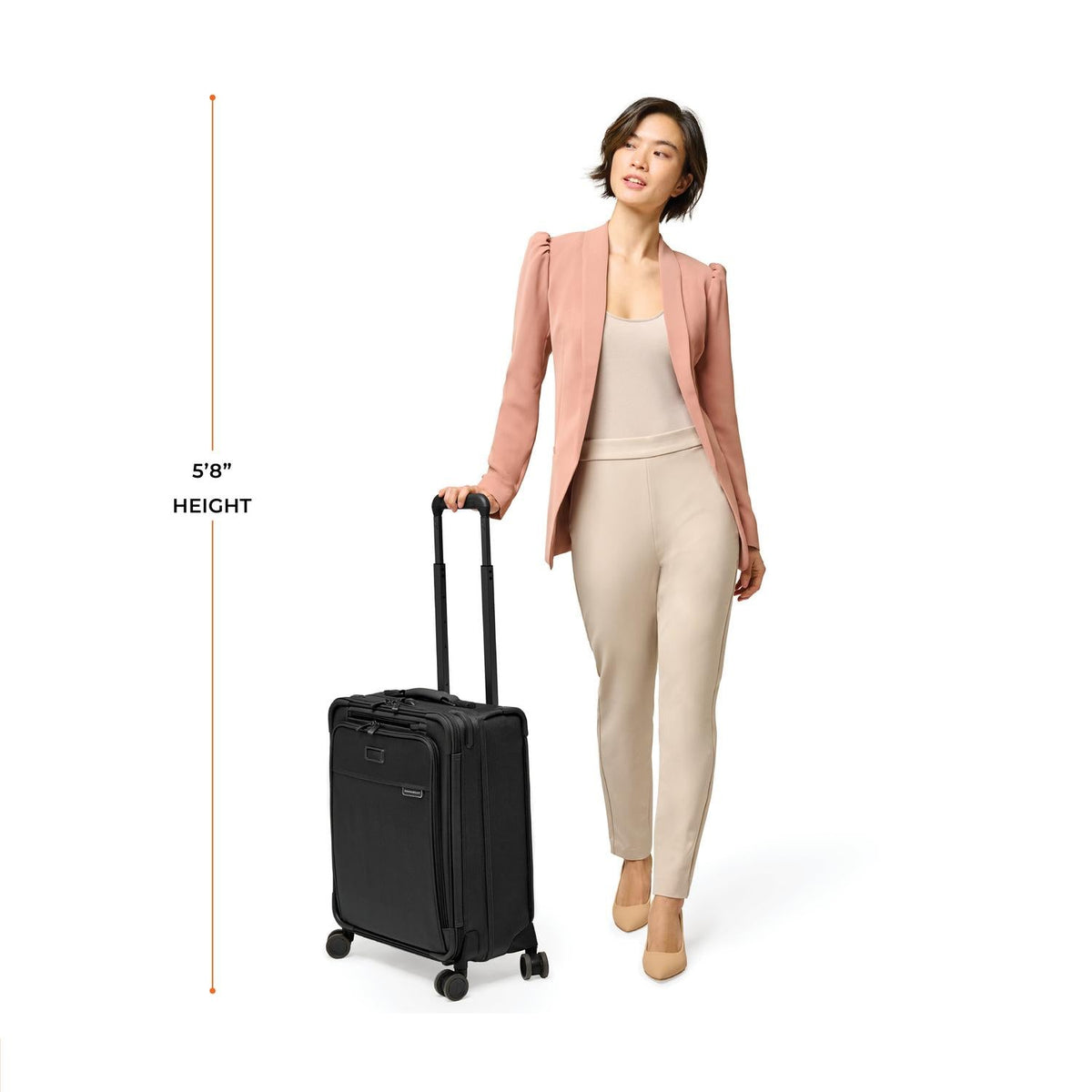 Briggs & Riley Baseline Global 21" Carry-On Expandable Spinner in Black — lifestyle