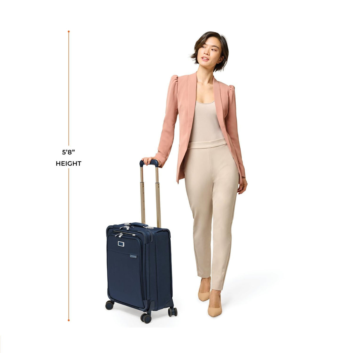 Briggs & Riley Baseline Global 21" Carry-On Expandable Spinner in Navy — lifestyle