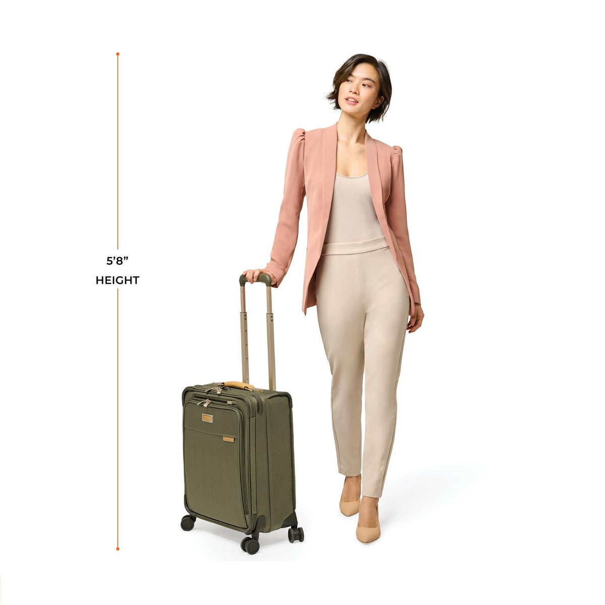 Briggs & Riley Baseline Global 21" Carry-On Expandable Spinner in Olive — lifestyle