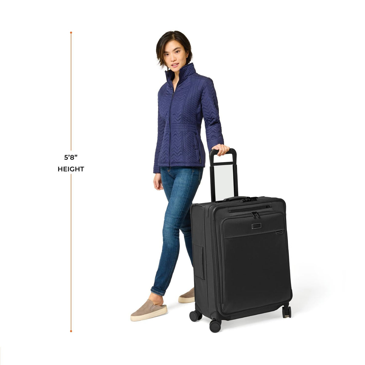 Briggs & Riley Baseline Medium Expandable Spinner in Black — lifestyle 2