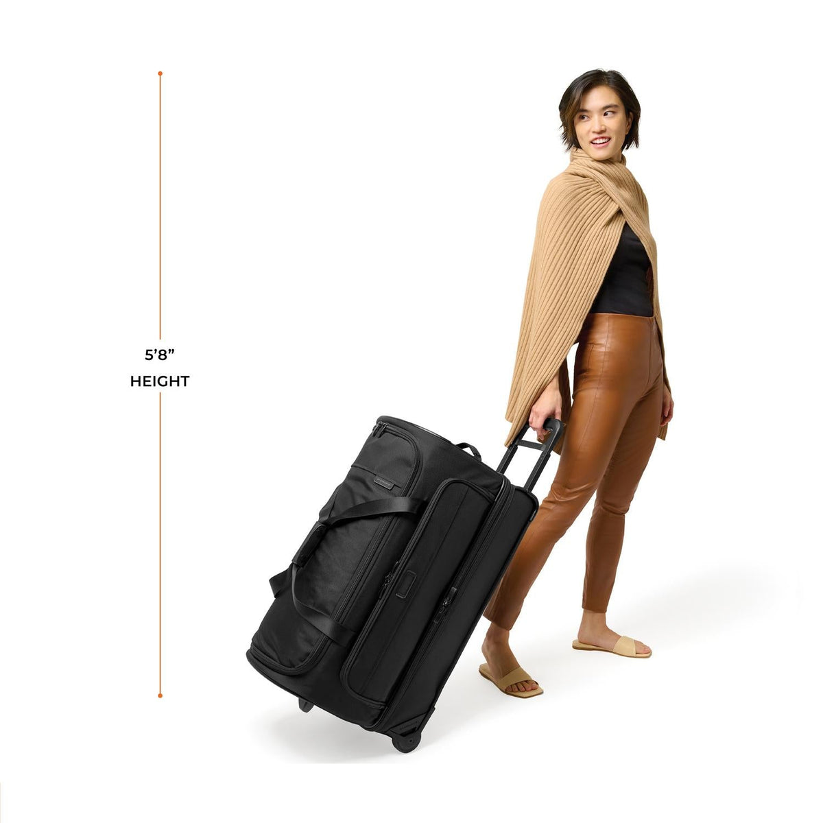 Briggs & Riley Baseline Medium 2-Wheel Duffle in Black — lifestyle