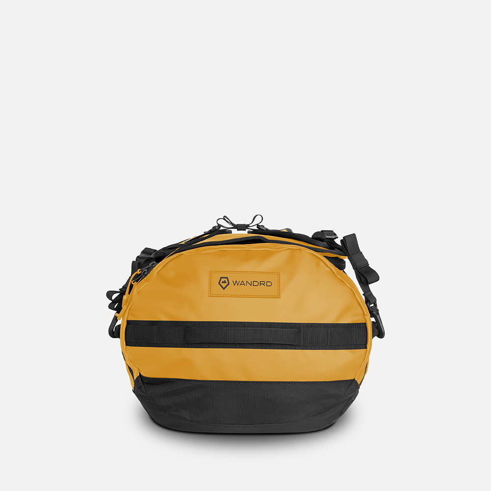 WANDRD CARRYALL Duffel 30L in Dallol Yellow — angle view 2