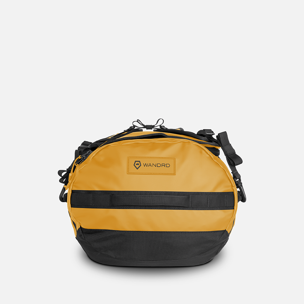 WANDRD CARRYALL Duffel 60L in Dallol Yellow — angle view 2