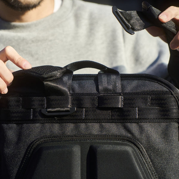 Chrome Industries Cohesive 2.0 38L travel pack – person wearing the pack on the back