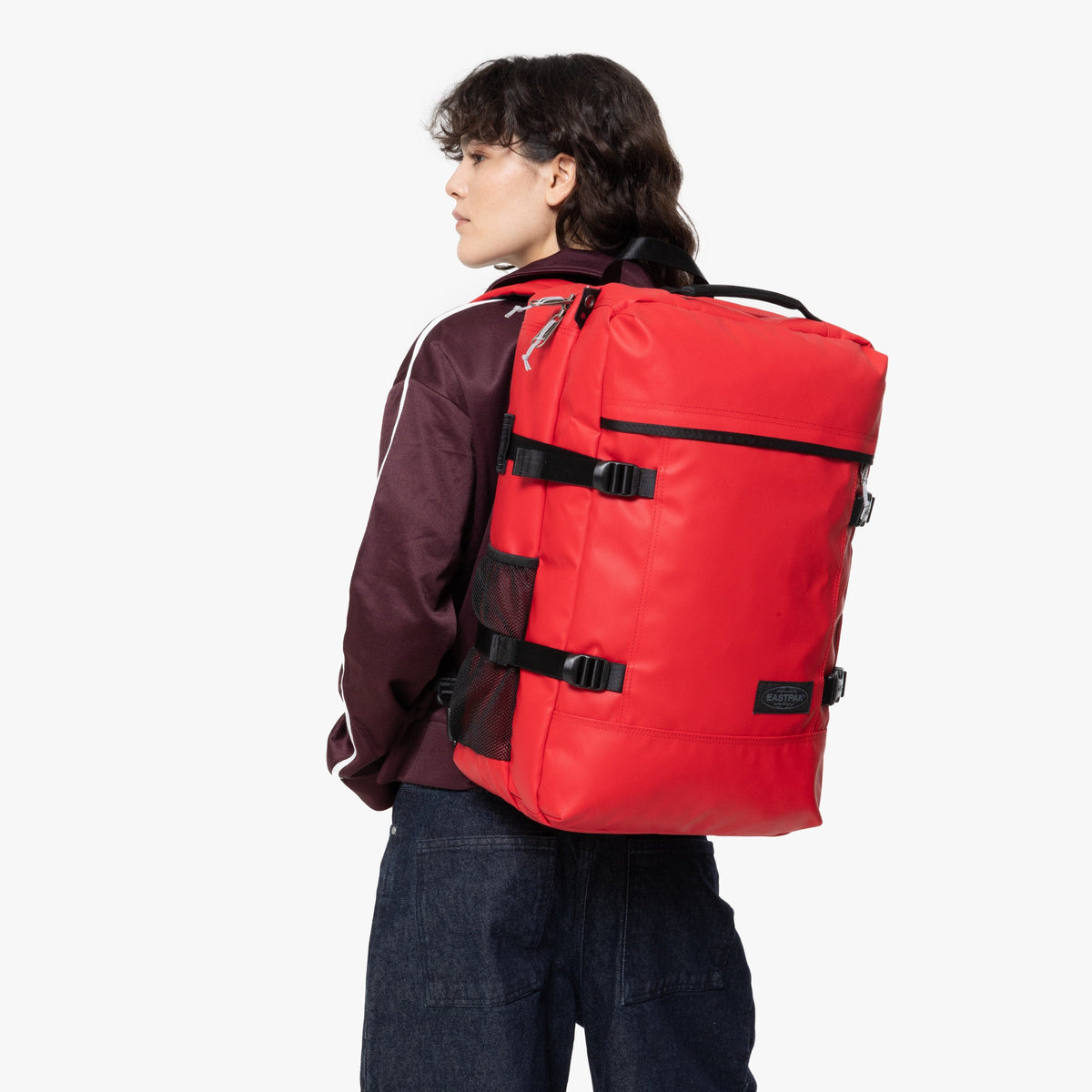 Eastpak Travelpack Backpack Tarp Edition 42L in Tarp Red — lifestyle