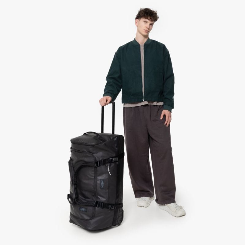 Eastpak Duffel Pack Wheel L Wheeled Duffel 90L in Tarp Black — lifestyle # color_Tarp Black