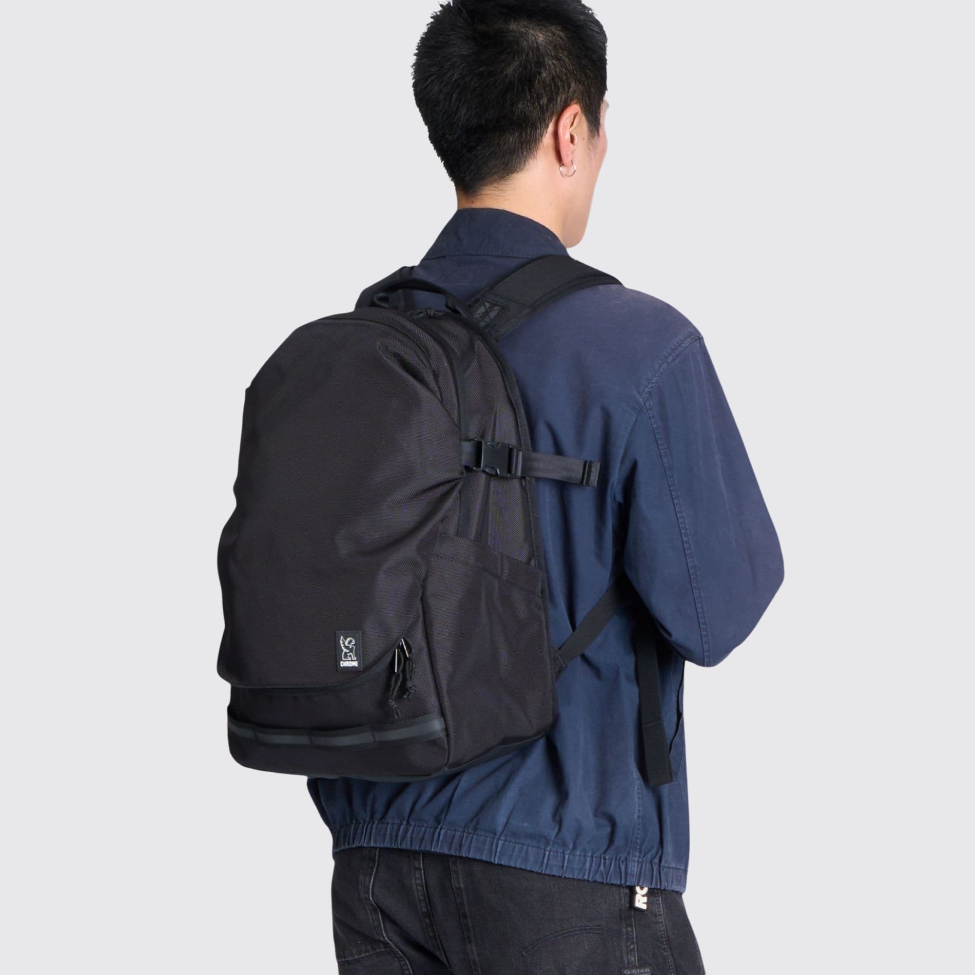 Chrome Industries Extlek Pack 24L in Black — lifestyle # color_Black