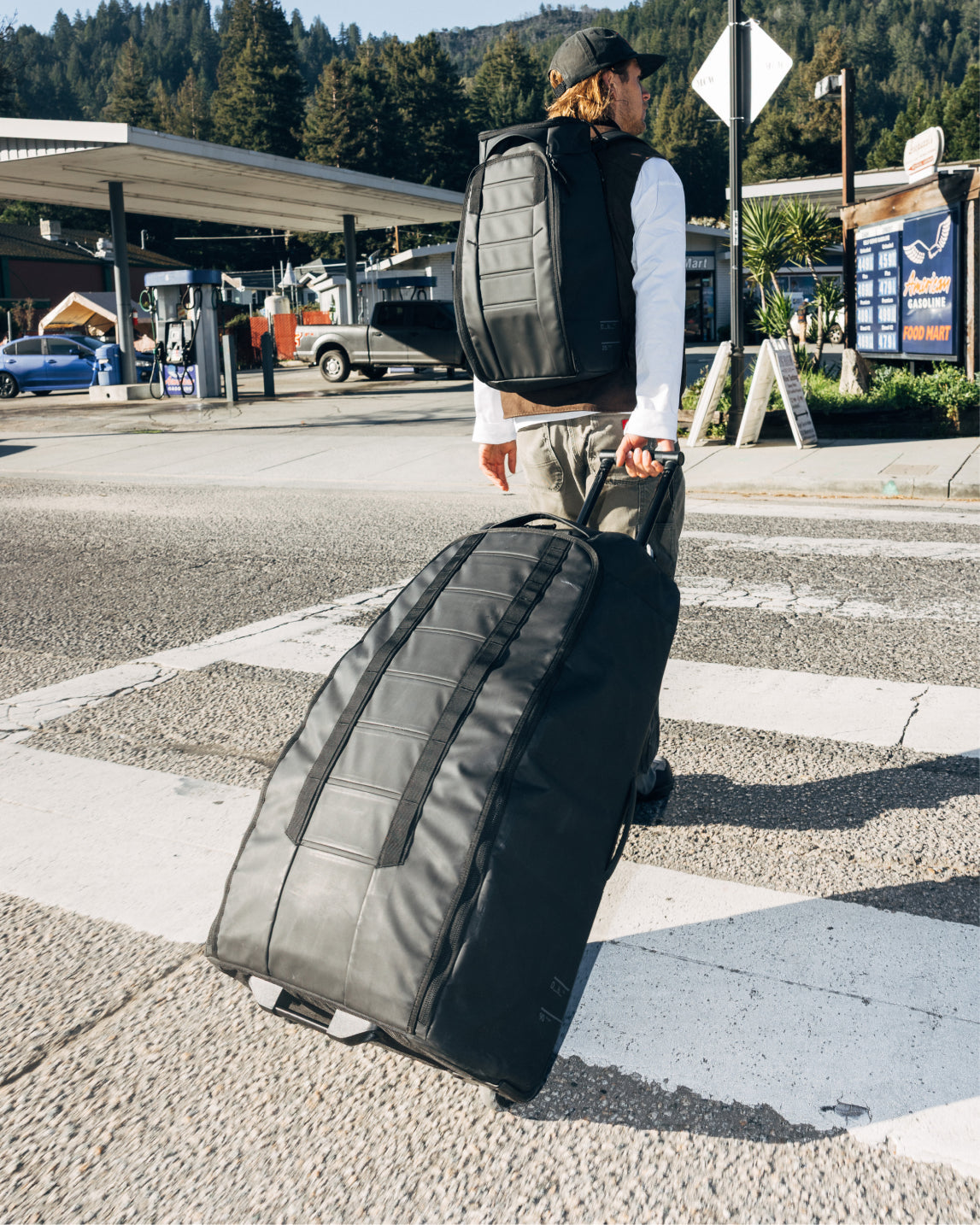 Db Journey Hugger Roller Bag Check-in 90L in Black Out — lifestyle # color_Black Out