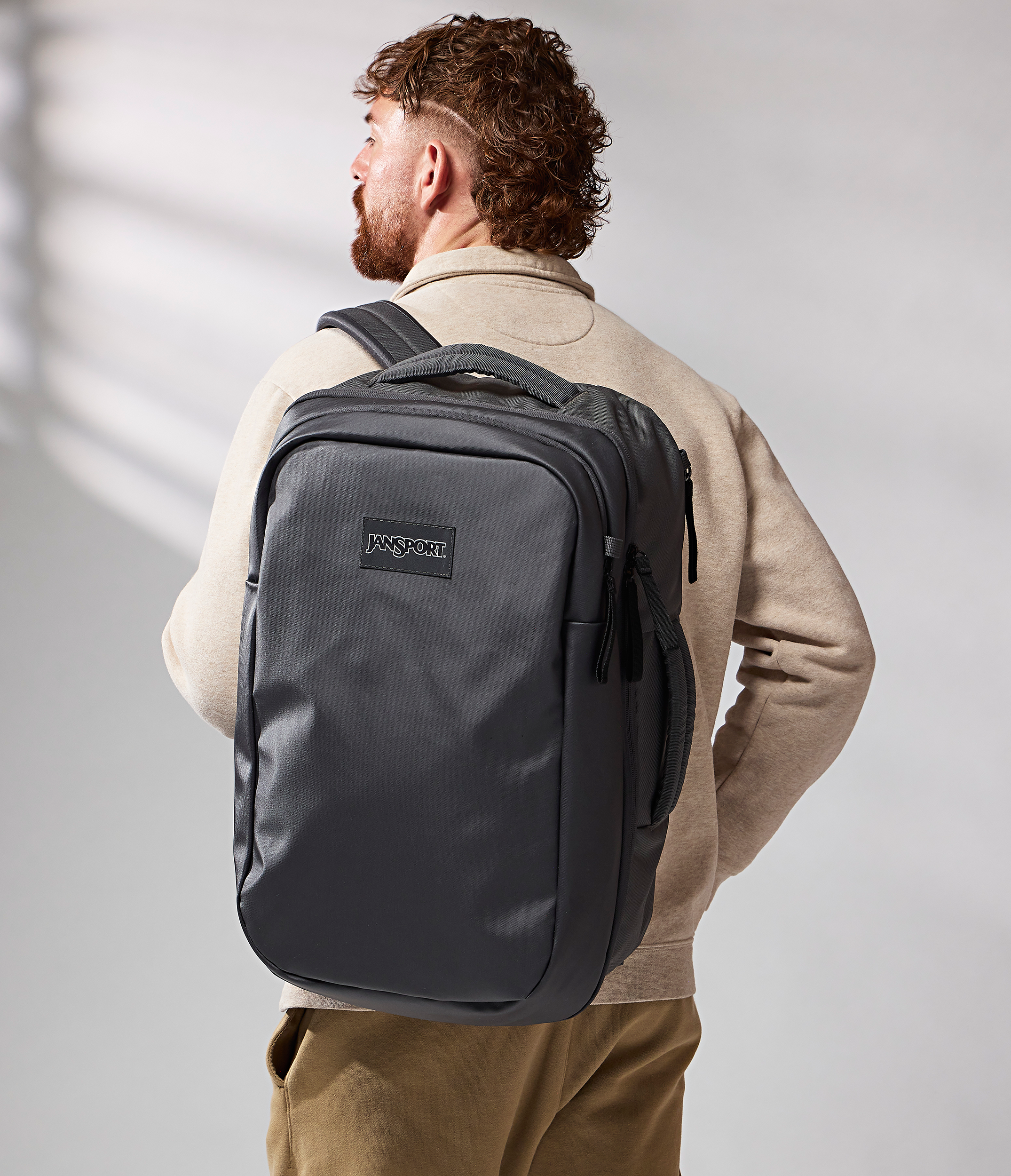 JanSport Good Latitude Travel Pack 40L in Smokey Grit — angle view 2