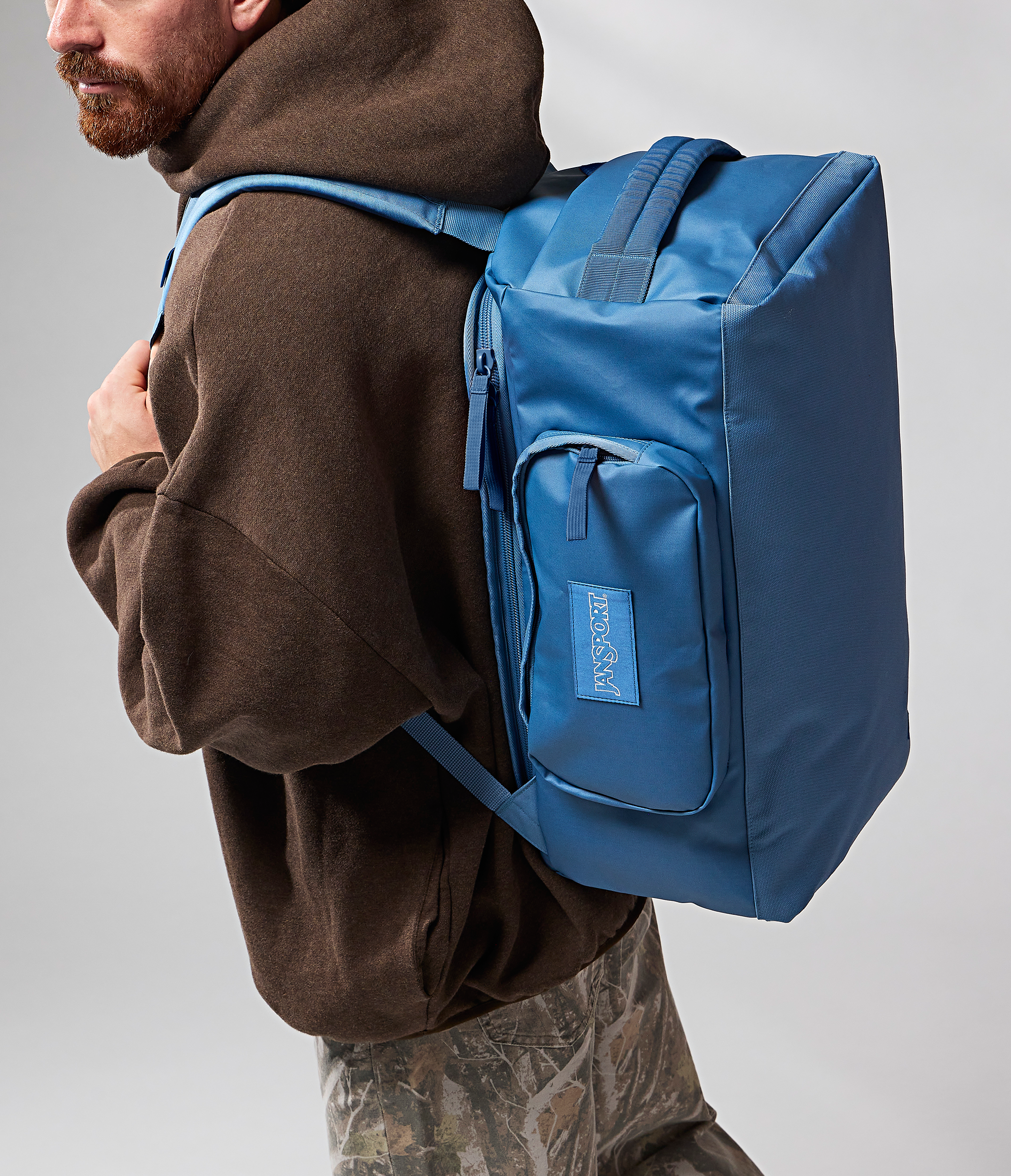 JanSport Good Latitude Convertible Duffel in Elemental Blue — angle view 2