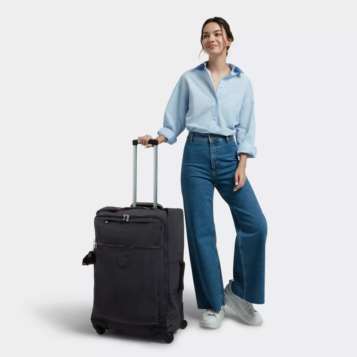 Kipling Darcey Medium Rolling Luggage in Black Tonal — lifestyle