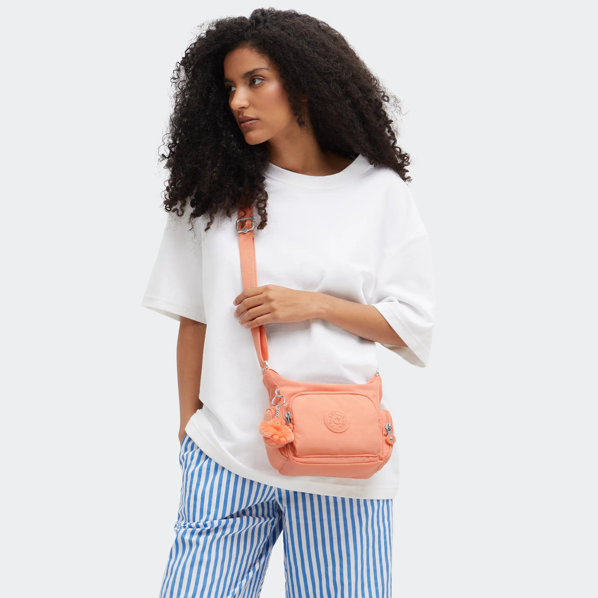 Kipling Gabbie Mini  Crossbody Bag in Pinky Orange — lifestyle