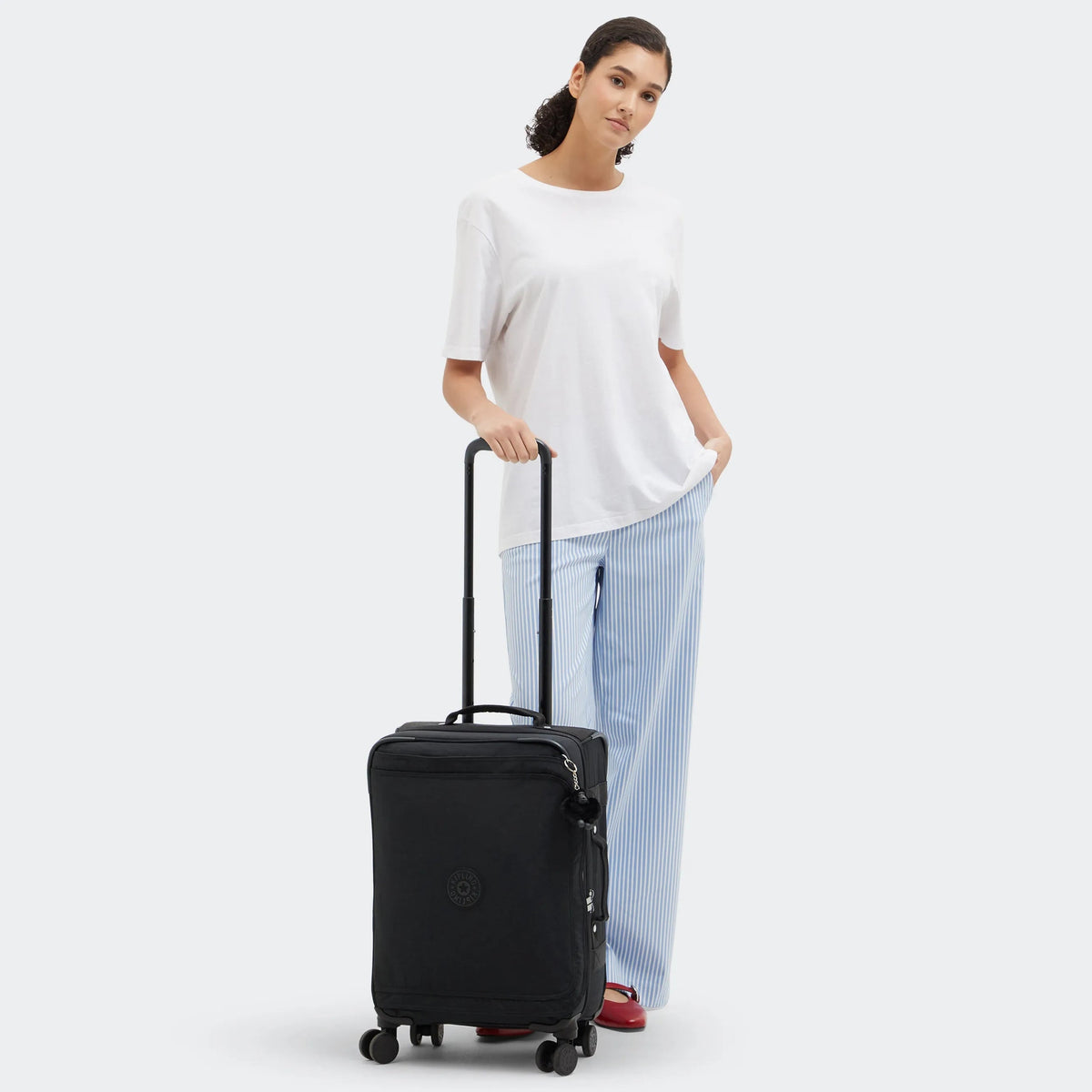 Kipling Spontaneous Small  Rolling Luggage-Carry On in Black — lifestyle