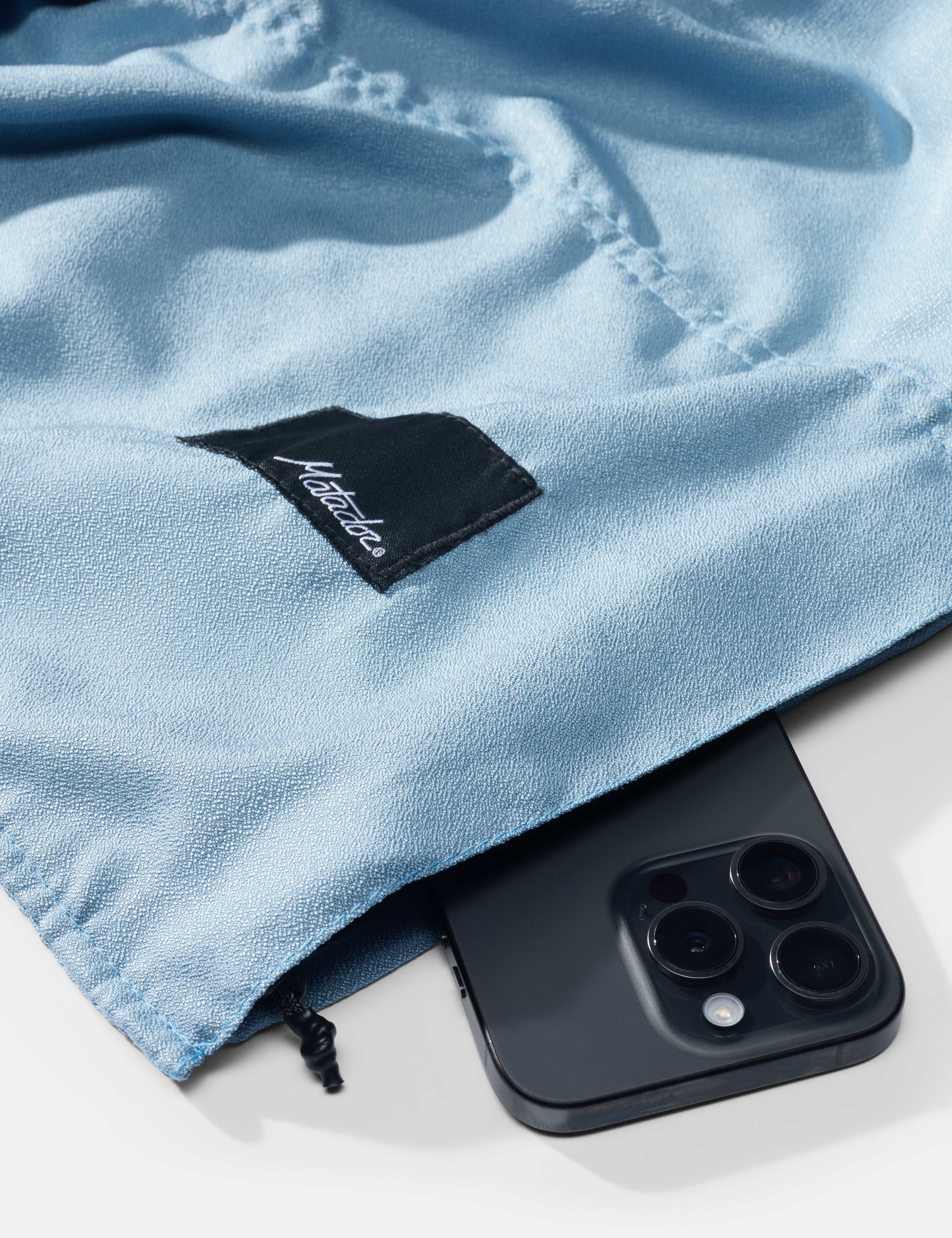 Matador NanoDry Packable Beach Towel in Slate Blue — angle view 3