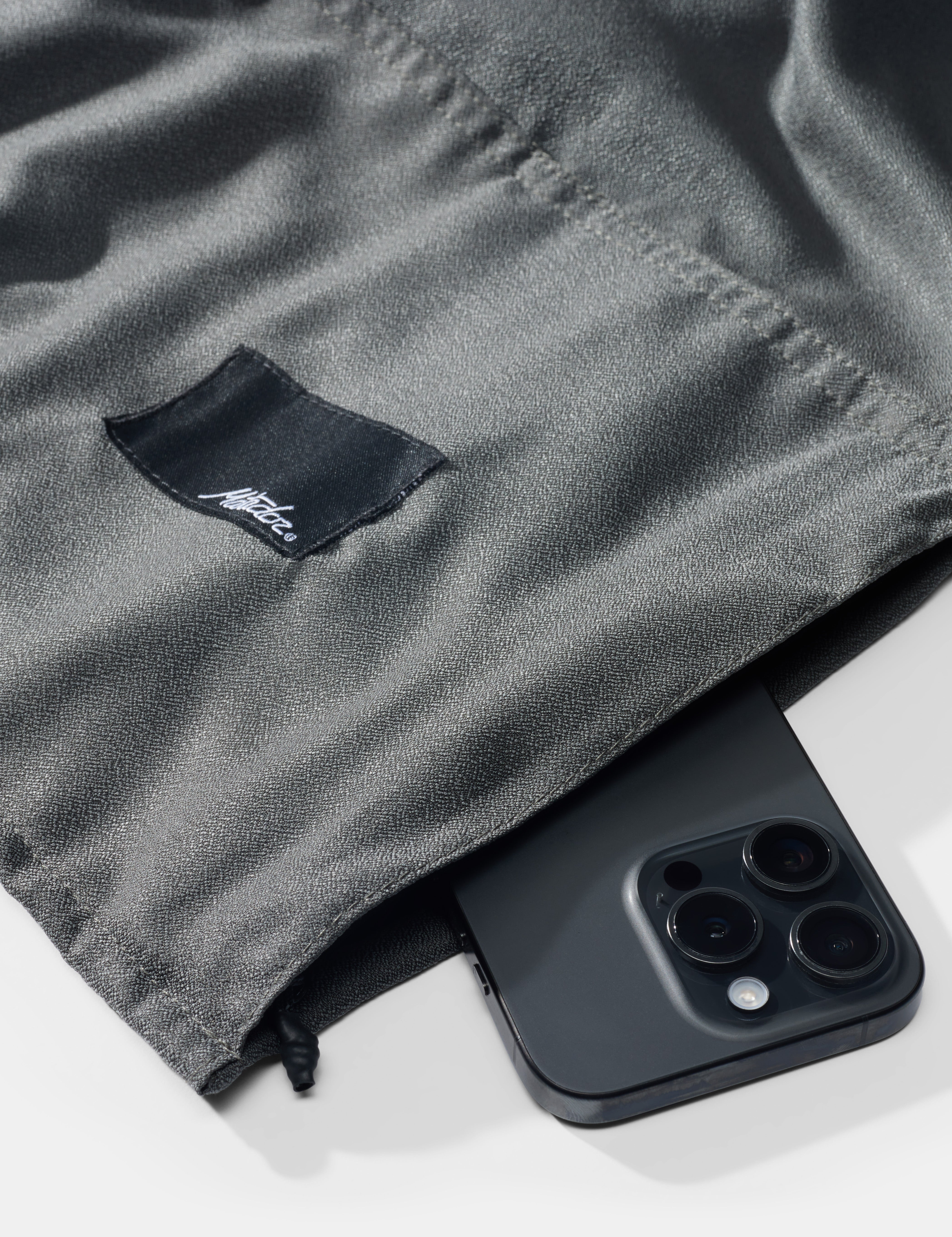 Matador NanoDry Packable Beach Towel in Charcoal — angle view 3