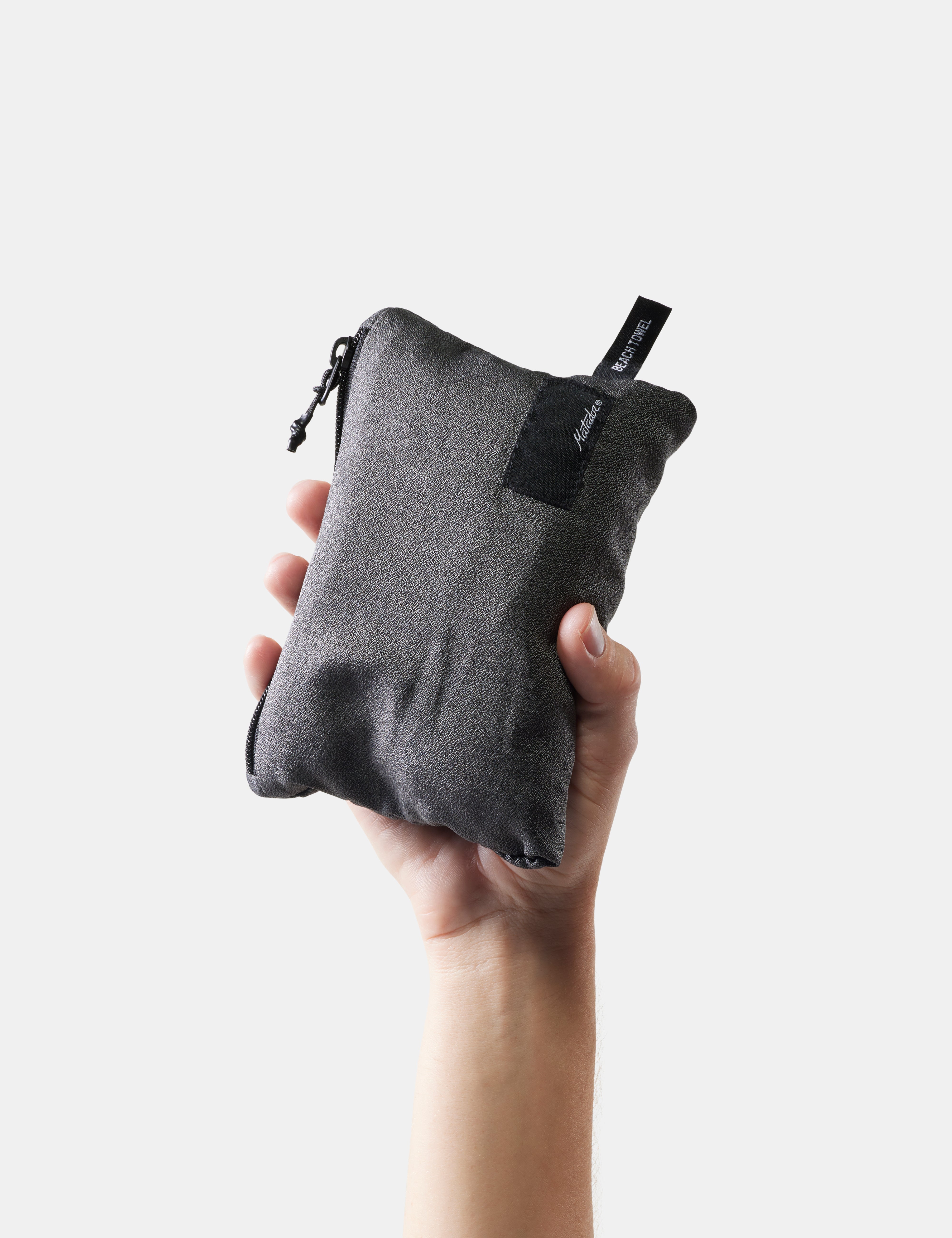 Matador NanoDry Packable Beach Towel in Charcoal — lifestyle