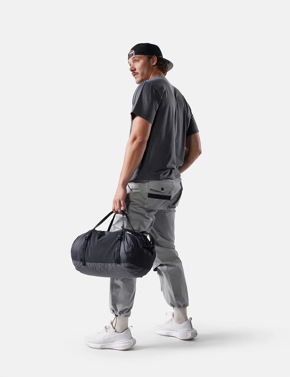Matador Freefly Packable Duffle 30L in Black — lifestyle 2